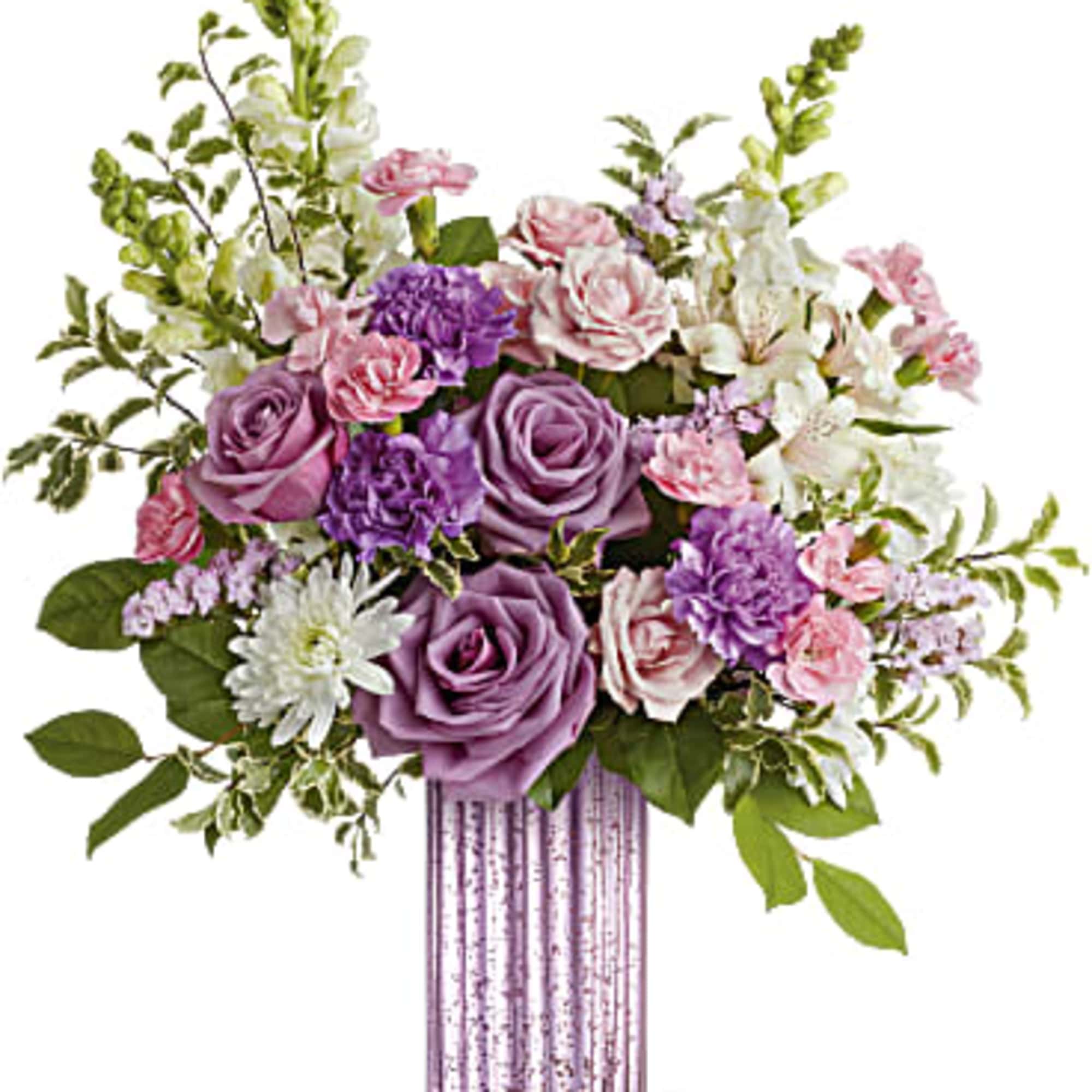Tall lavender and pink bouquet with roses and carnations in a ribbed pink glass vase