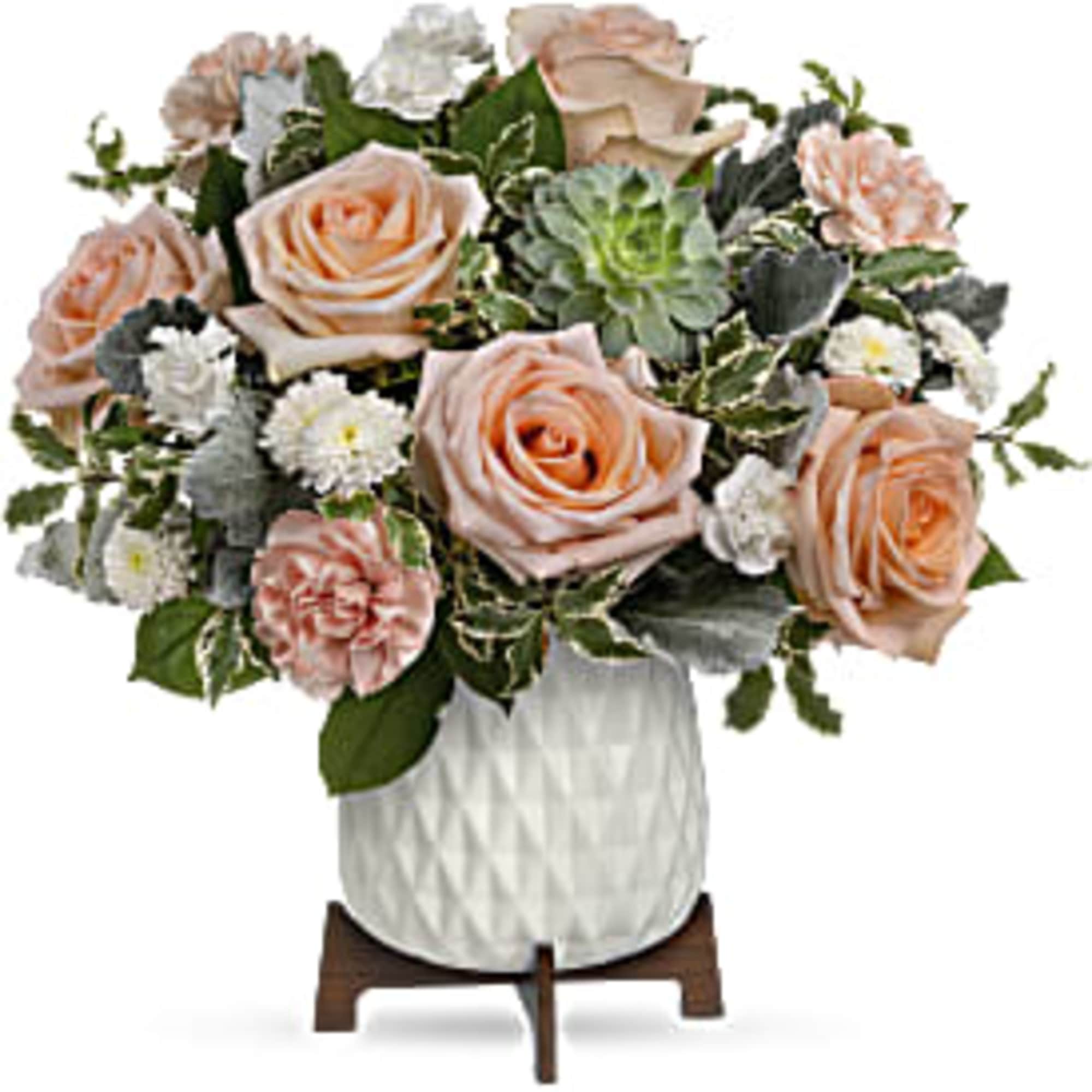 Low arrangement of peach roses, carnations, white mums, and a succulent in a white pot on a wooden stand