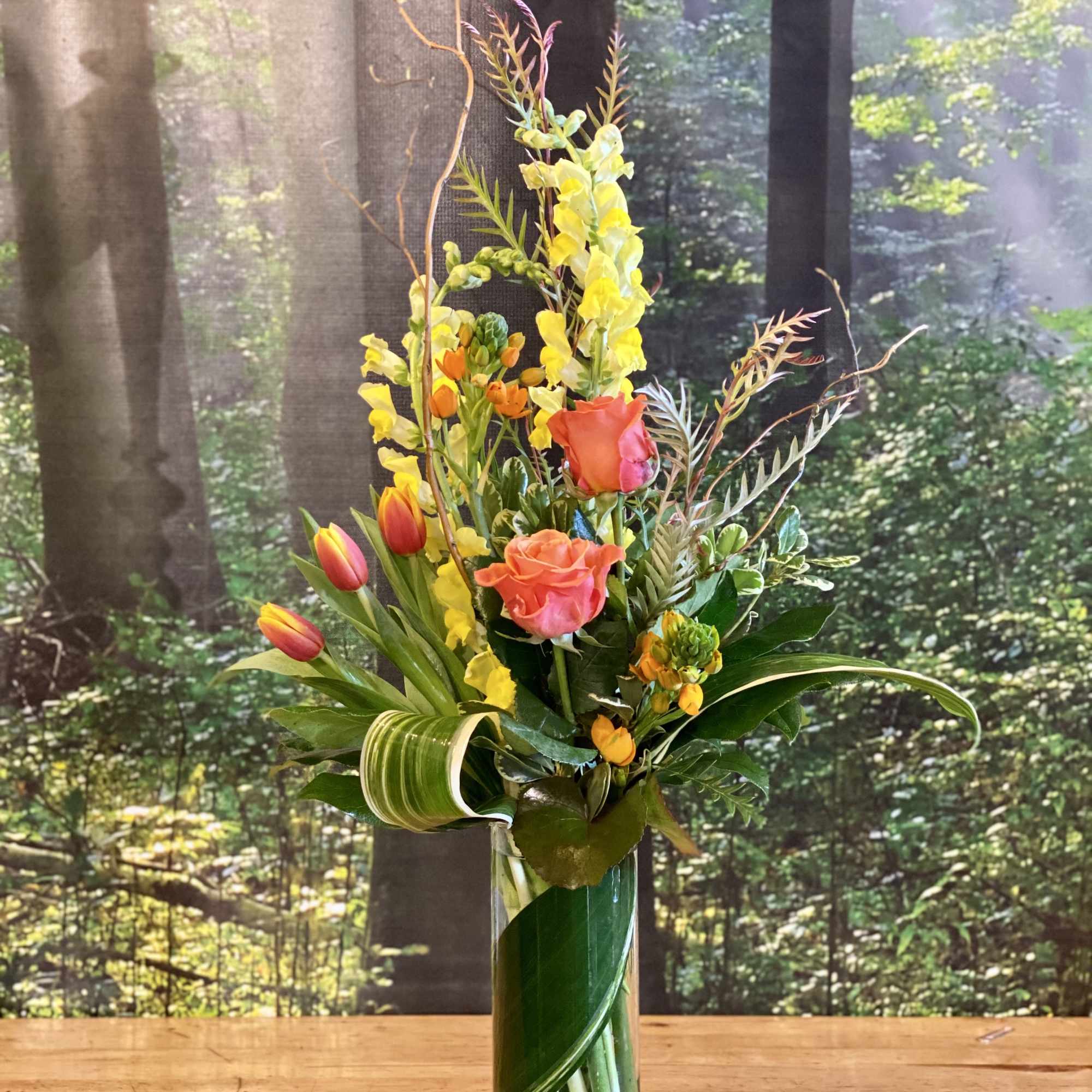 Send Spring Sunshine! Orange, Yellow and Green flowers in a naturalistic modern