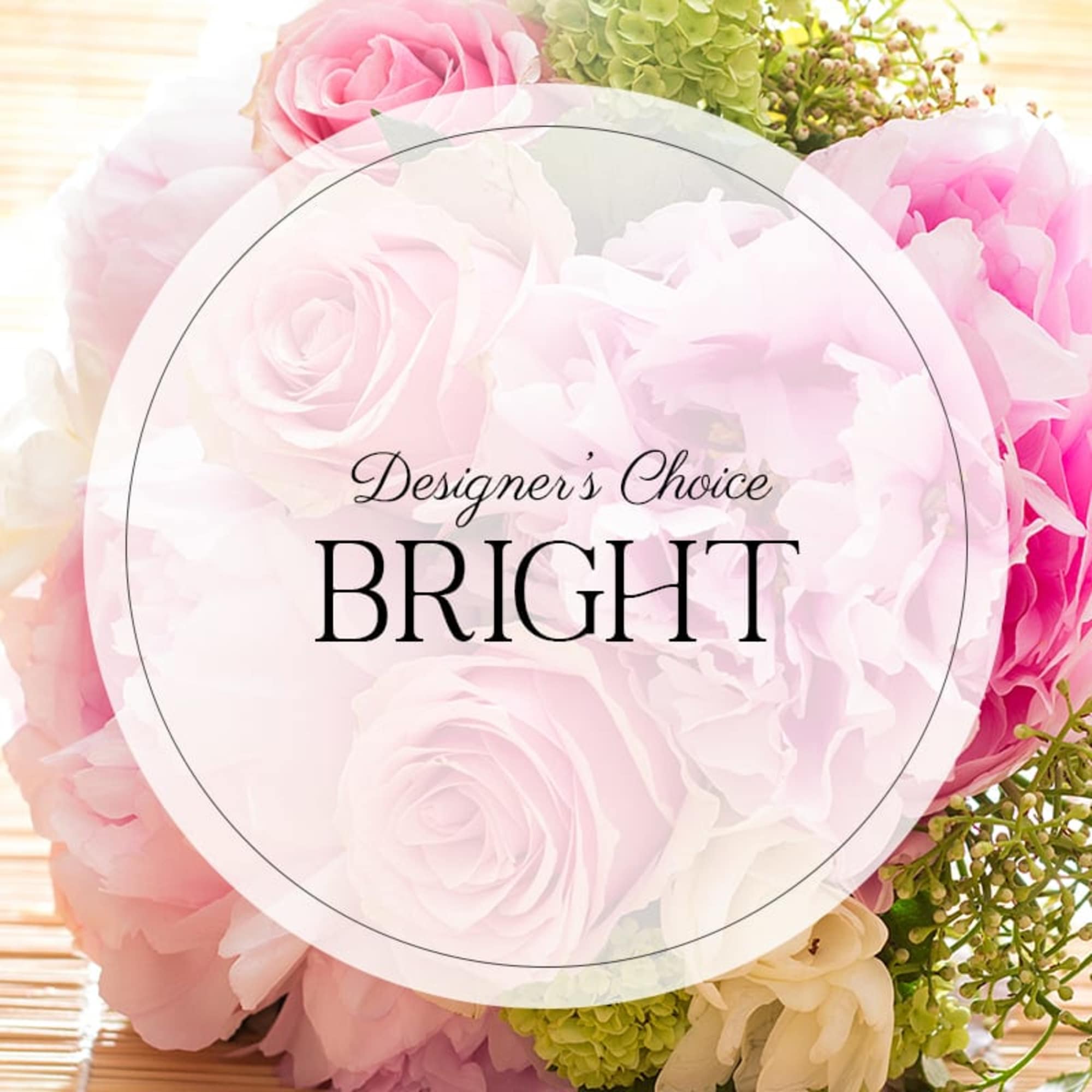 Close-up of pastel pink and white rose bouquet with green accents and circular text overlay reading Designer’s Choice Bright.