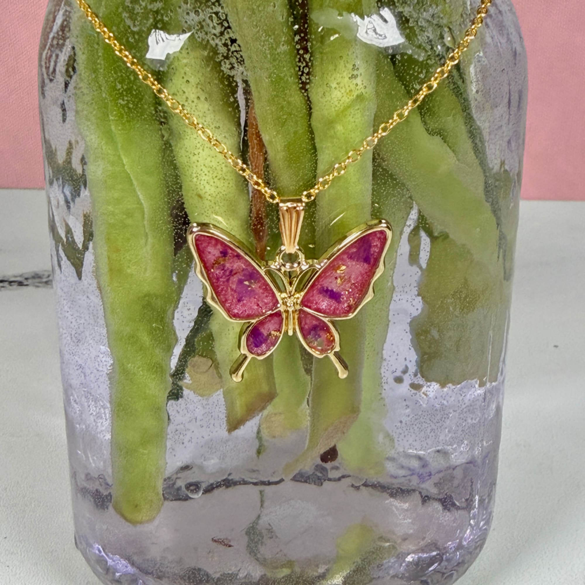 Soft and delicate purple and pink blooms are joined with airy filler