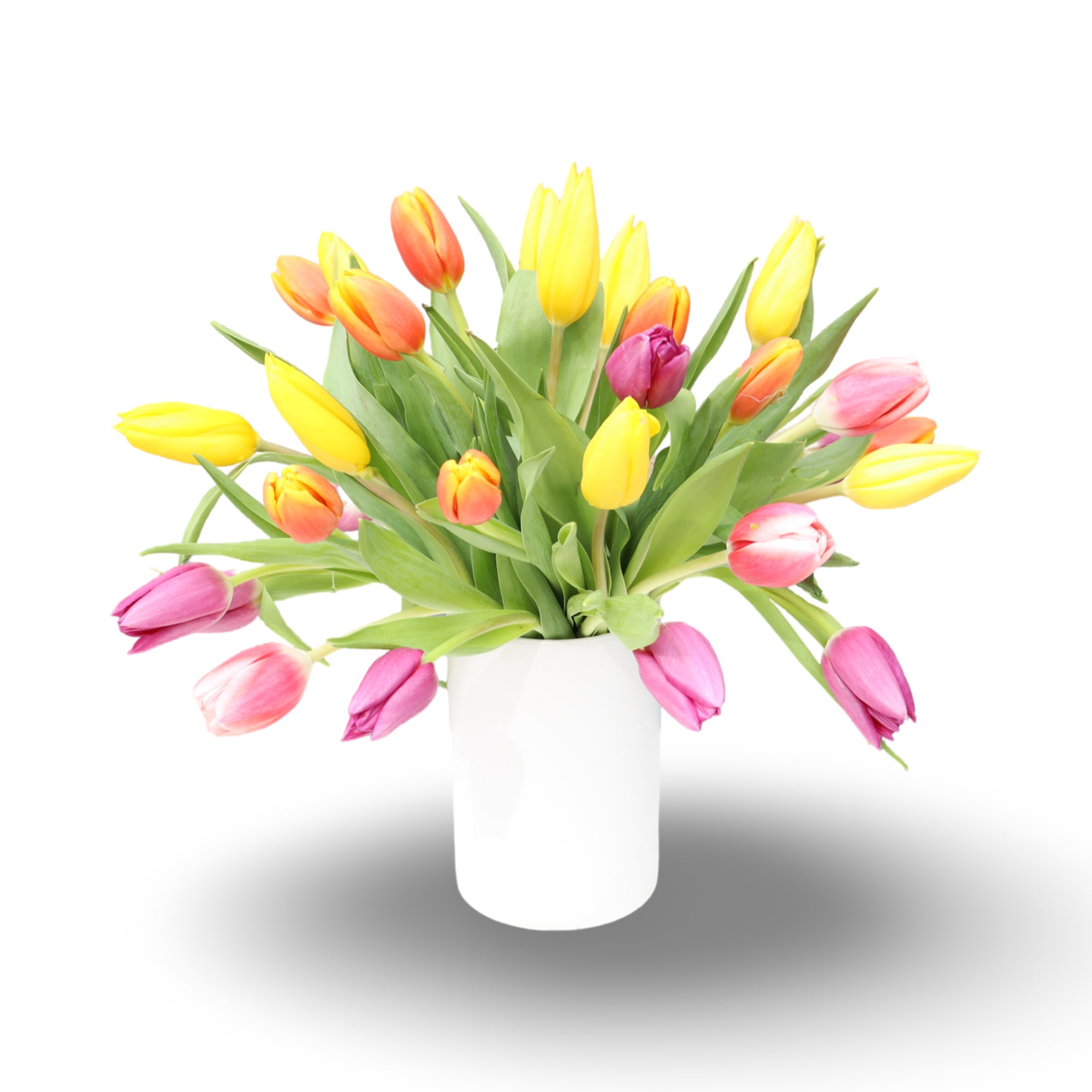 A lively cascade of yellow, pink, orange and soft purple tulips creates