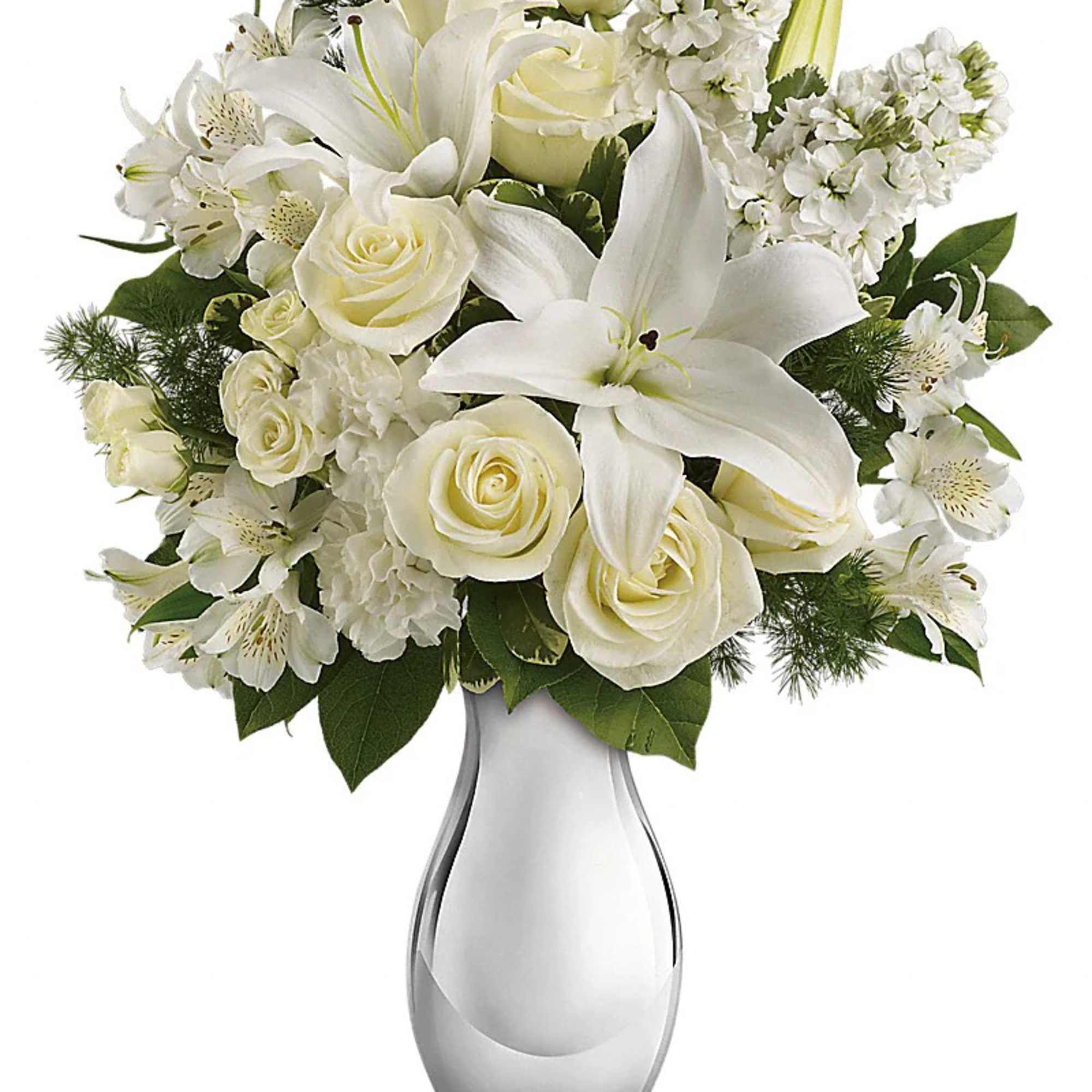 White lilies, roses, and other white flowers arranged in a silver vase