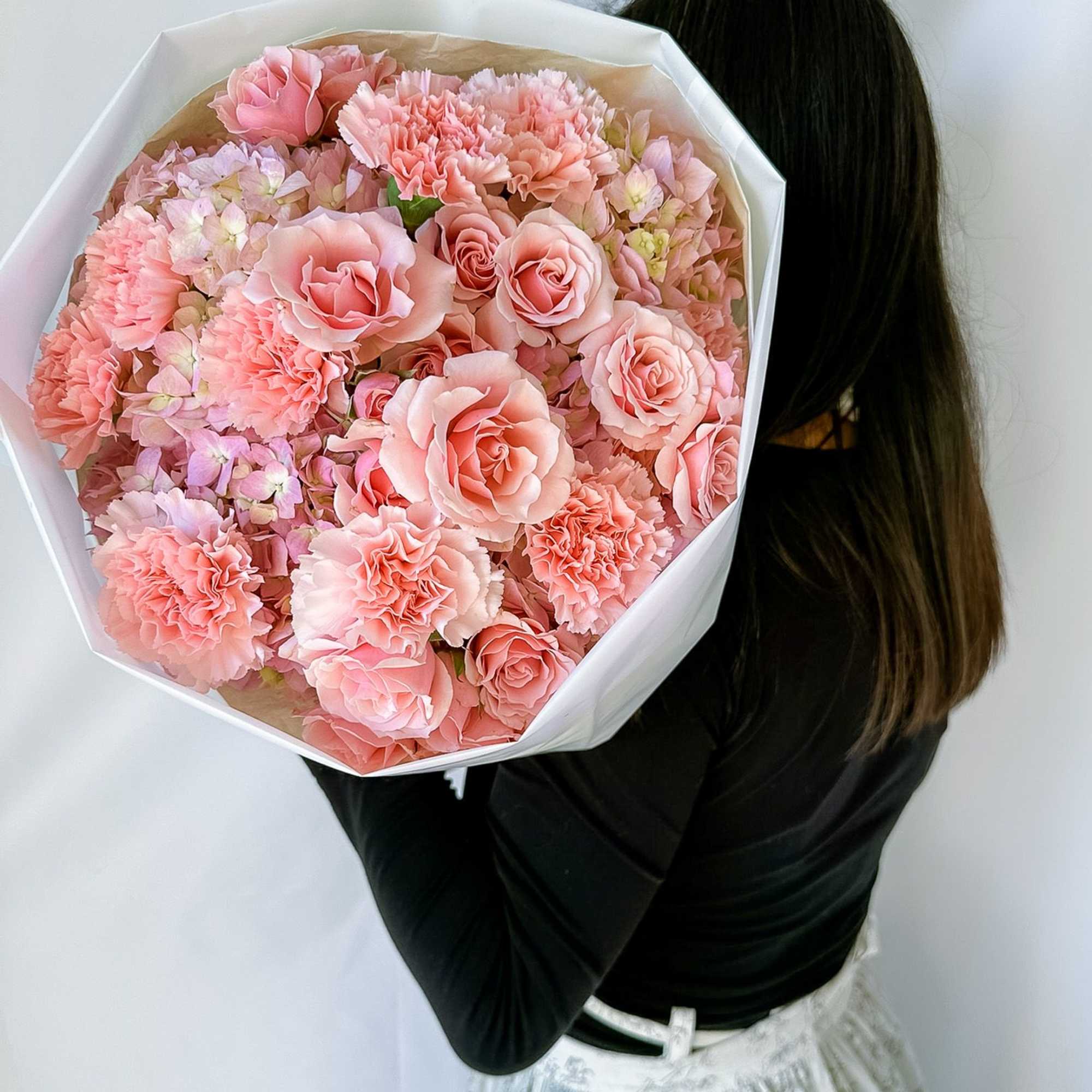 Our best-selling creation is designed to capture hearts. This round arrangement showcases