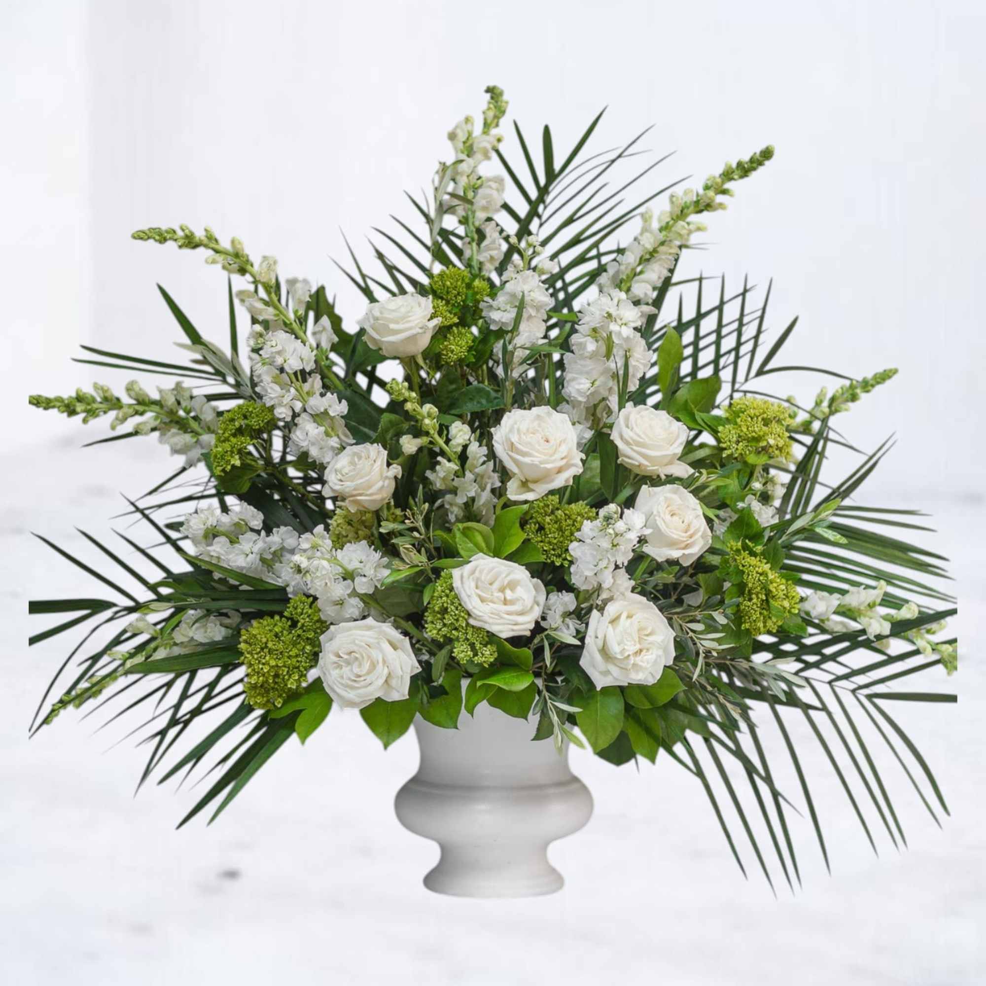 Elegant and timeless, Final Blessing features a serene arrangement of white roses