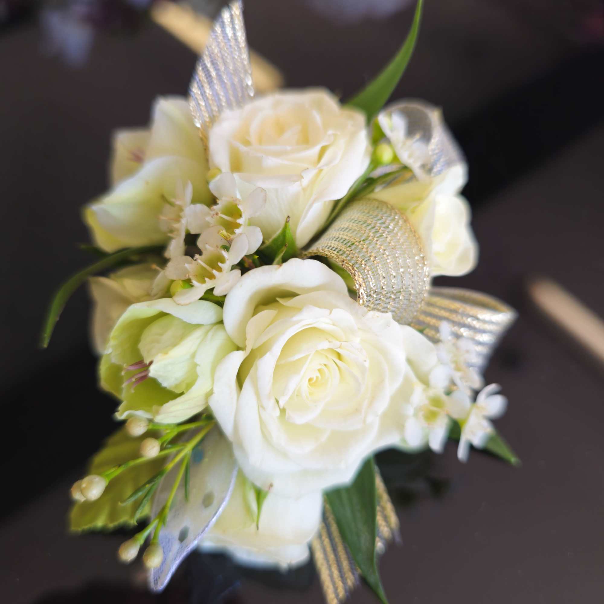 White rose corsage with silver ribbon accents