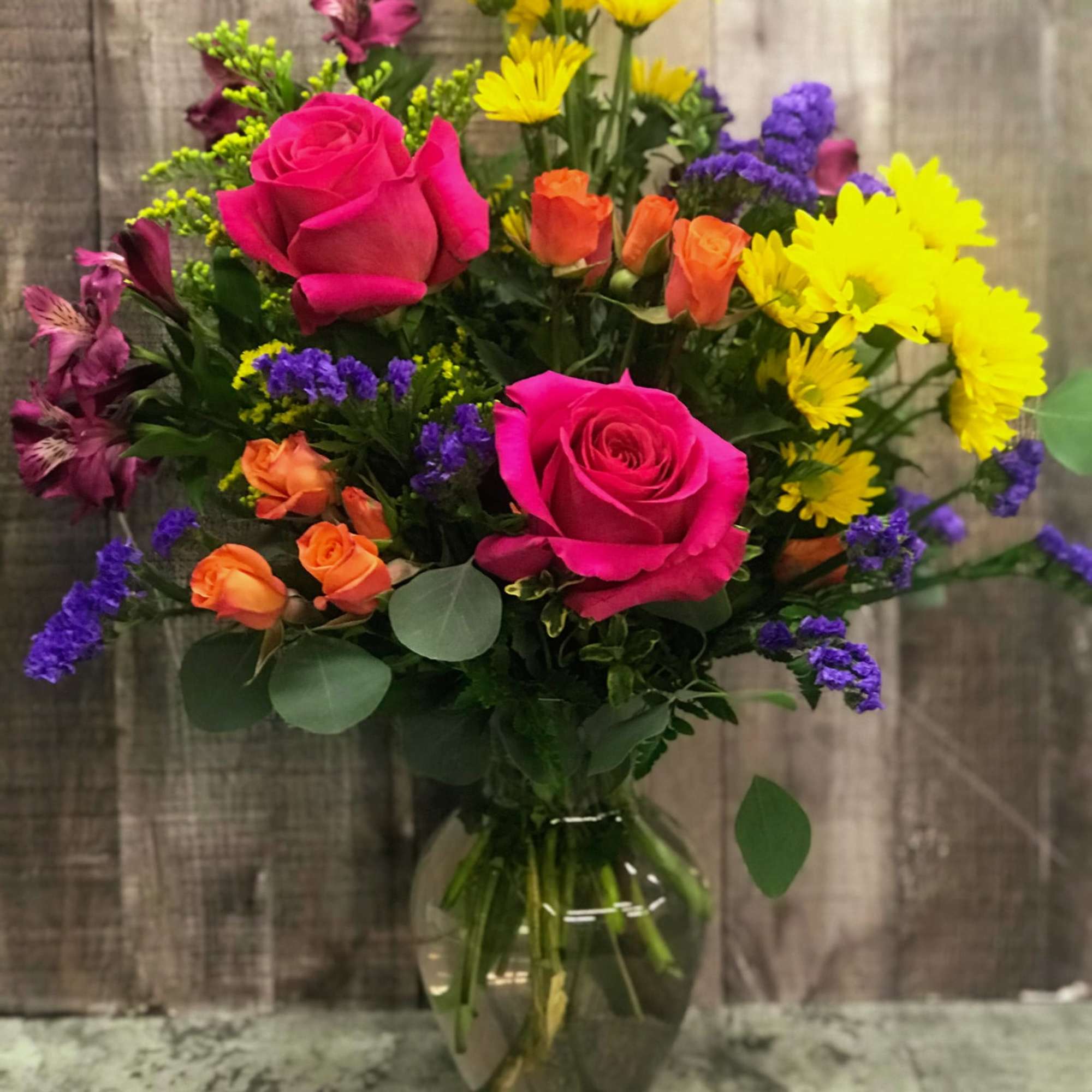 Happiness in a vase! A cheerful bouquet of assorted blooms arranged in