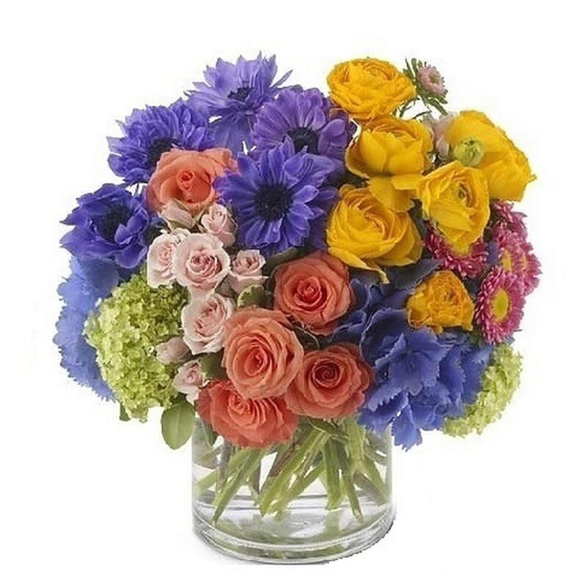 Bright mixed bouquet of blue daisies and peach and yellow roses in a clear glass cylinder vase