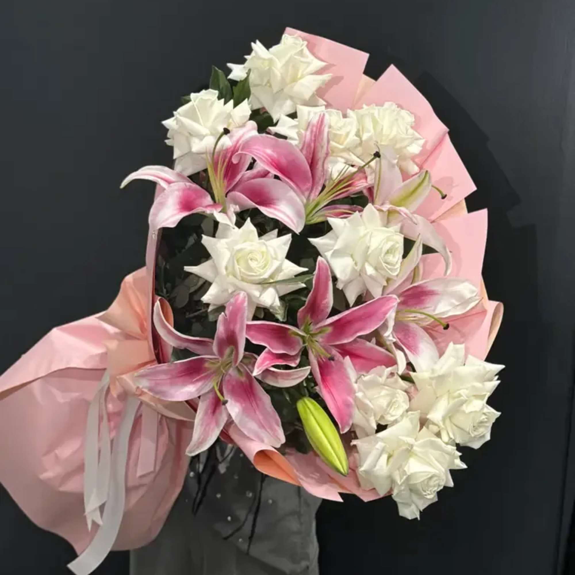 Blush Lily Charm is a timeless and expressive bouquet that combines the