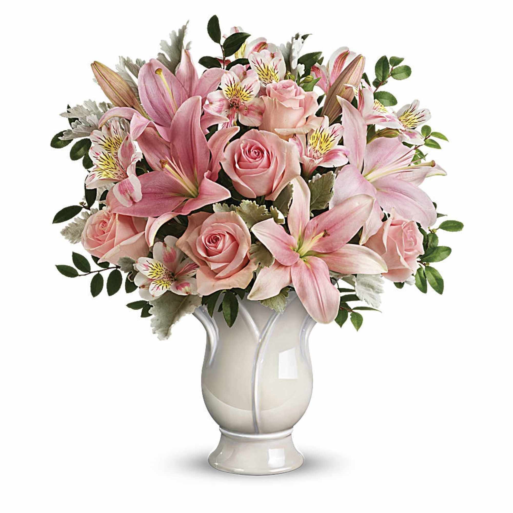 Arrangement of pink lilies, roses, and alstroemeria in a white ceramic vase