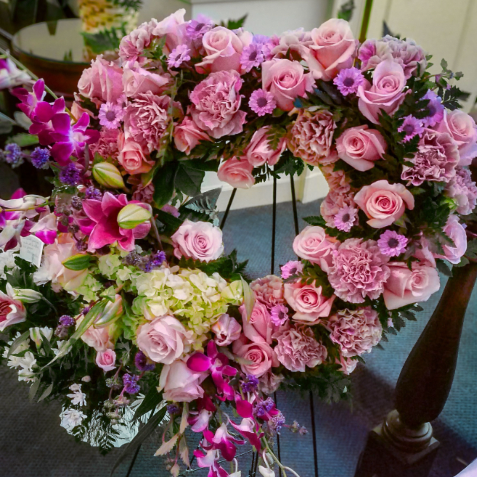 Presenting a stunning heart shaped standing spray, crafted with love and care.