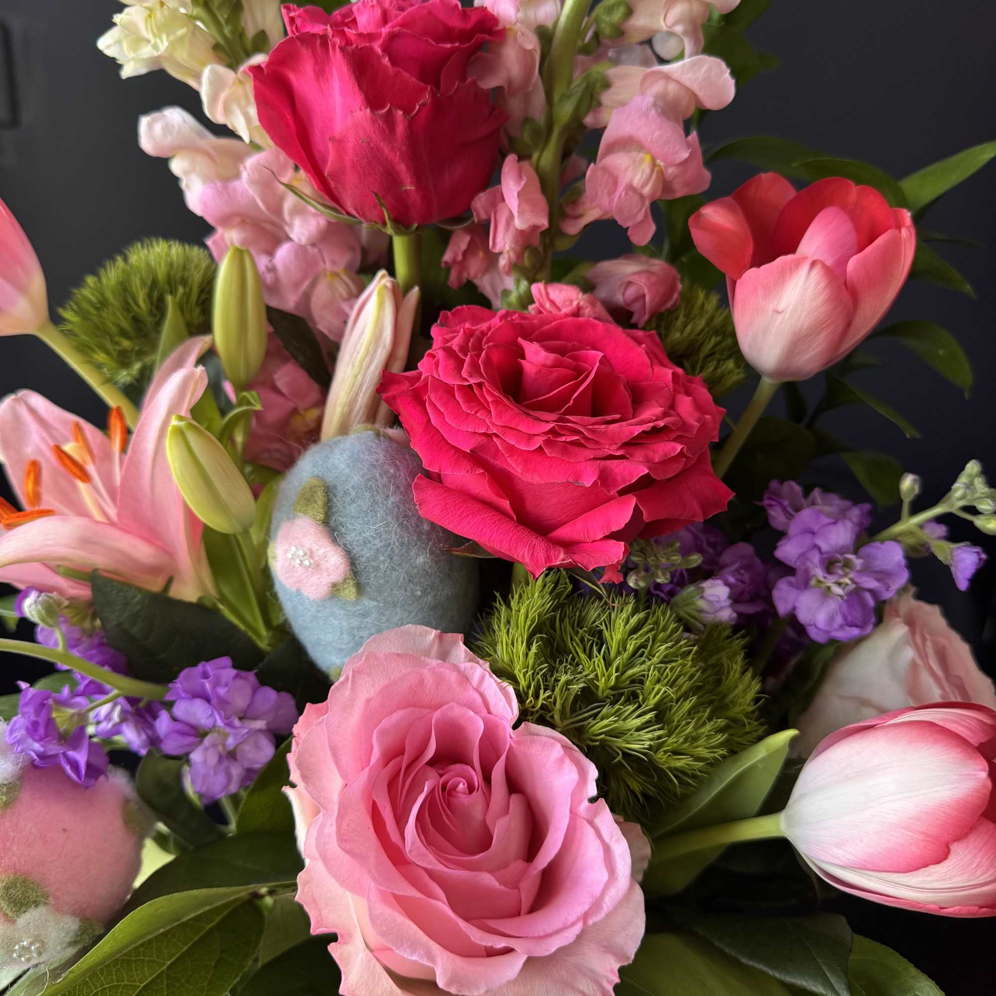 Easter Garden Delight is a vibrant spring composition designed to celebrate the