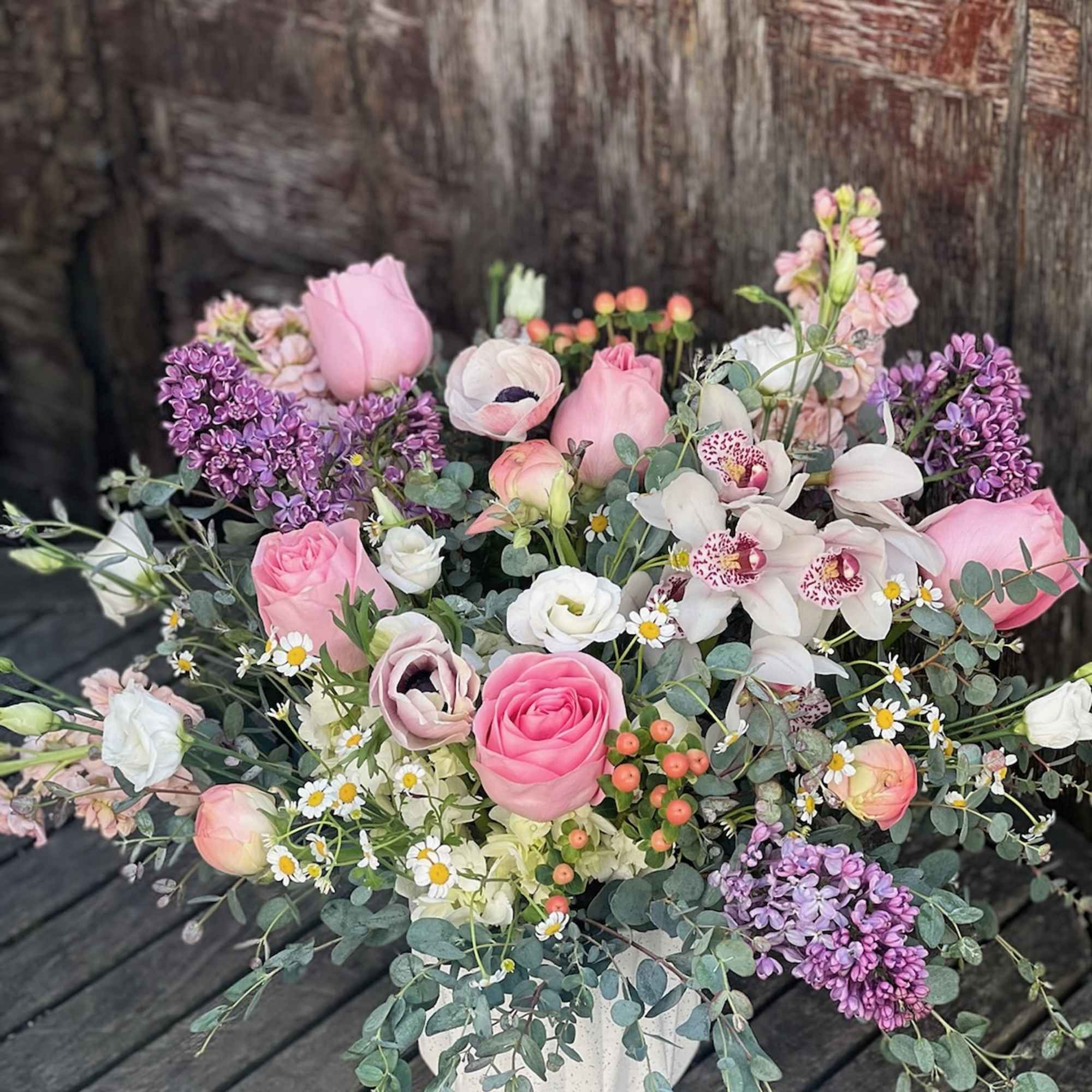 Pink and white mixed bouquet in a white vase