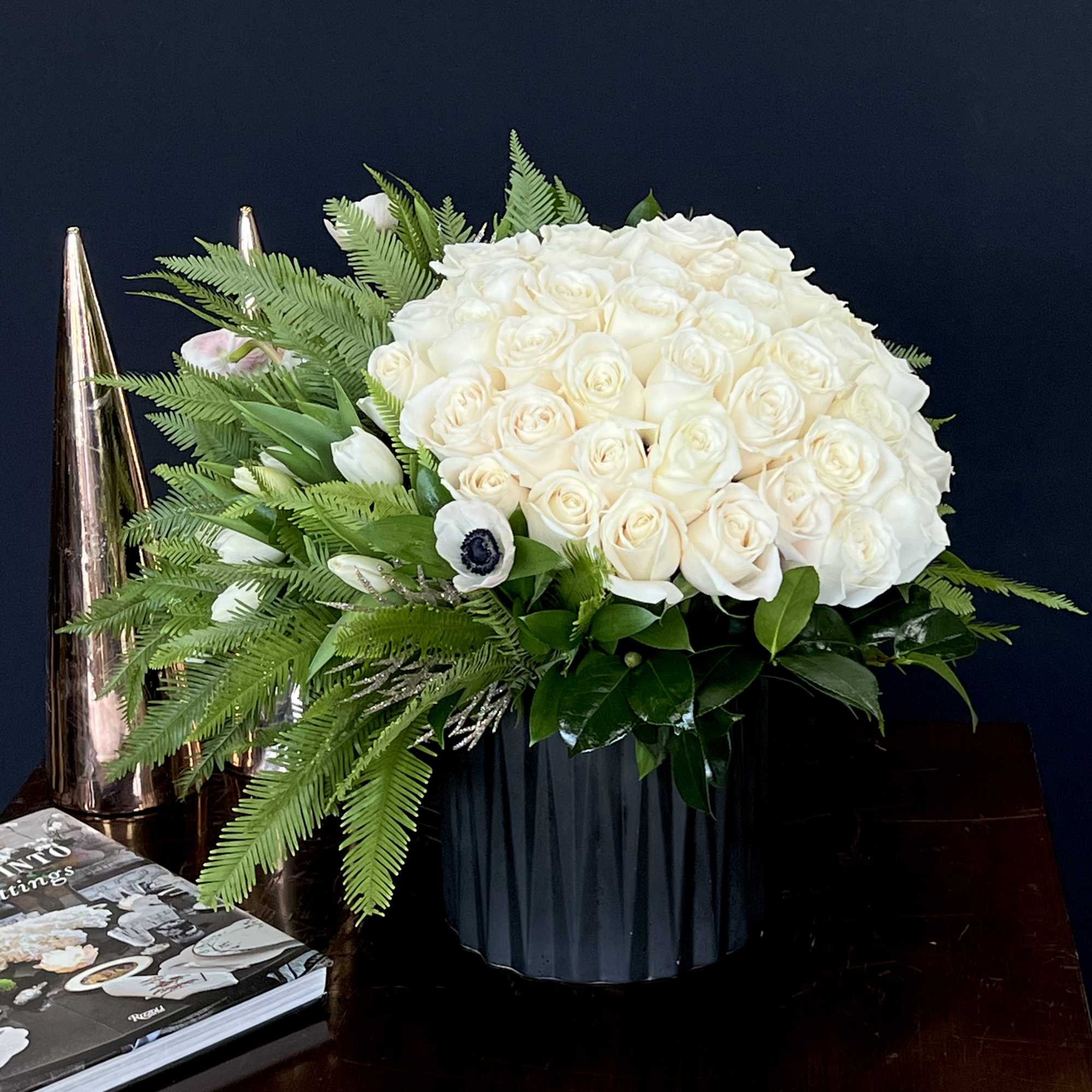 A beautiful bouquet of white Roses, with Tulips and Ferns in a