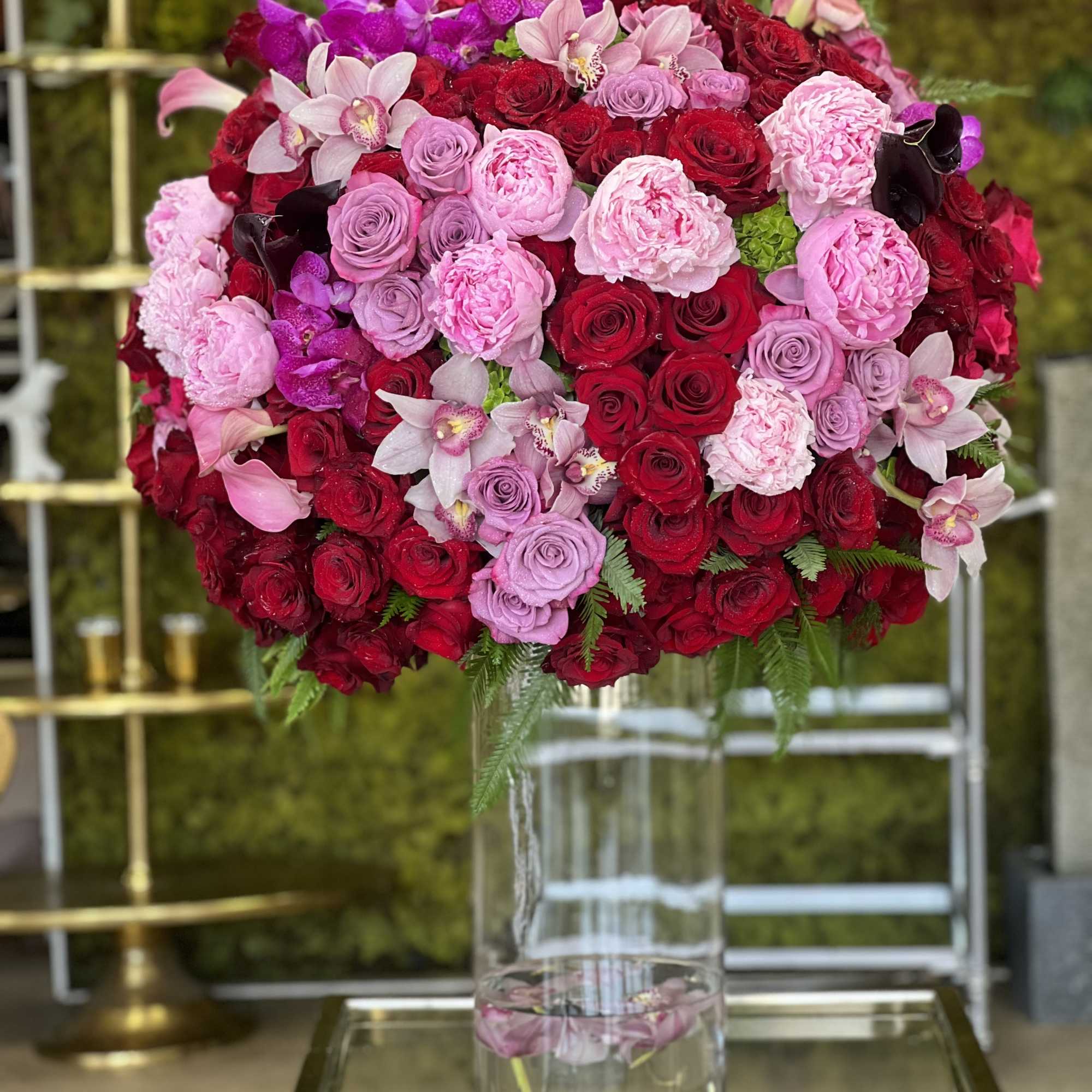 A grand arrangement with sexy and luxurious blooms... Truly a statement piece!

Featuring