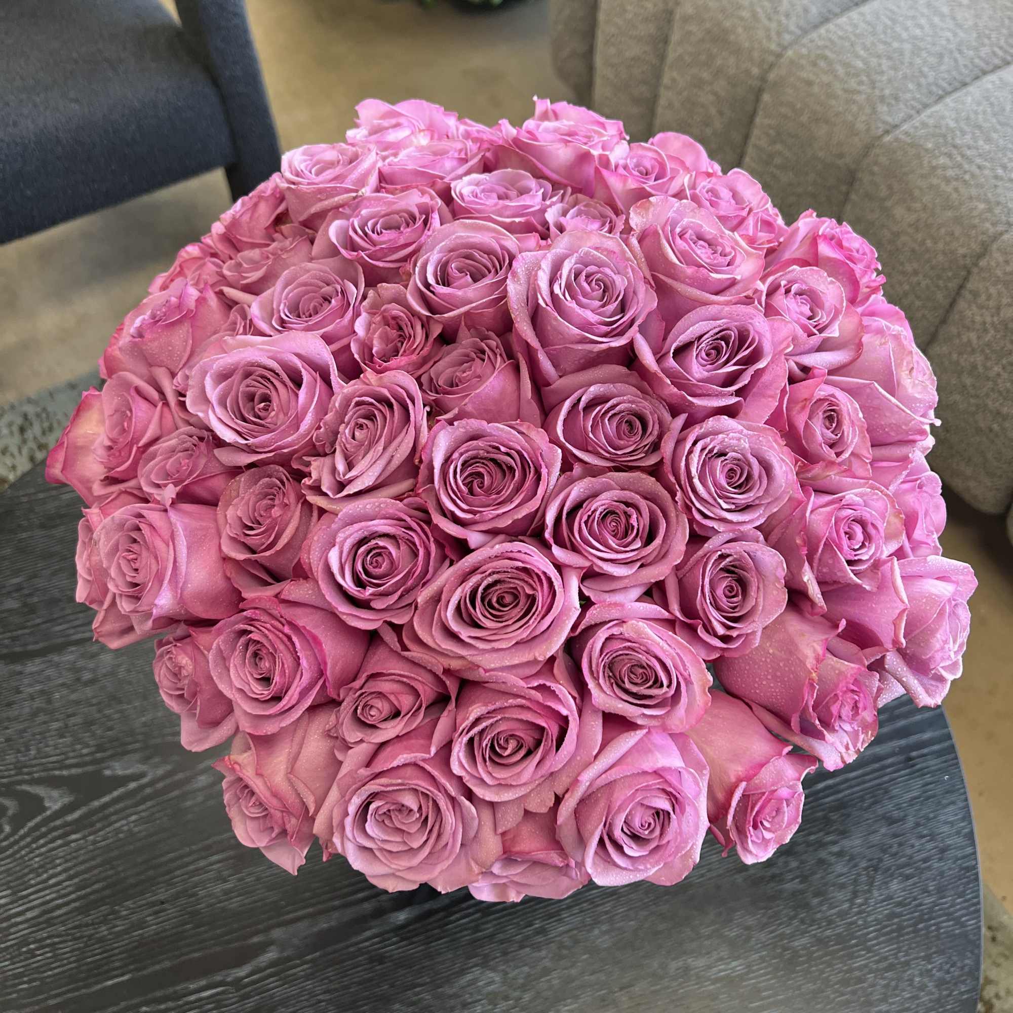 Round bouquet of pink roses on a table