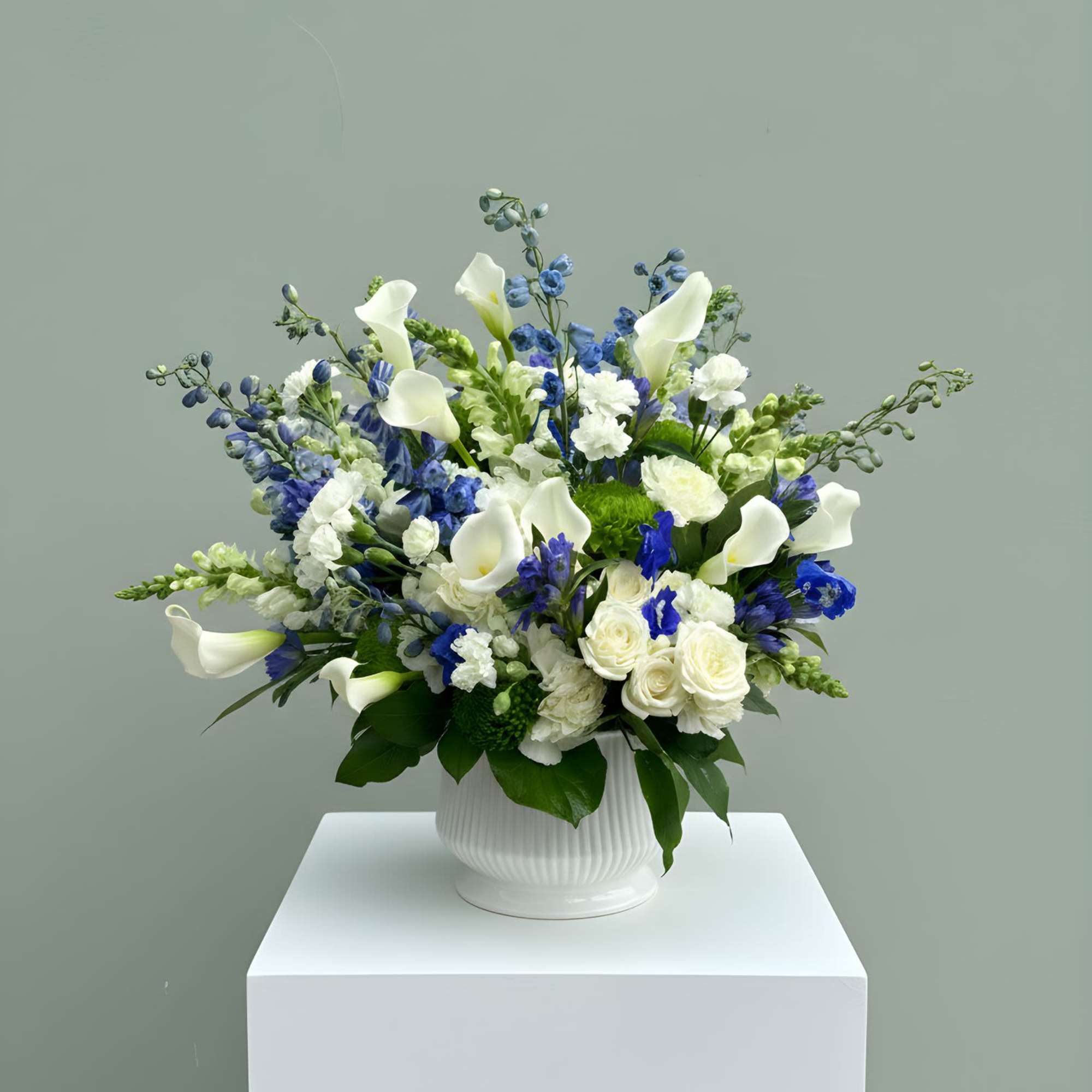 A refined and timeless floral arrangement featuring a stunning blend of crisp