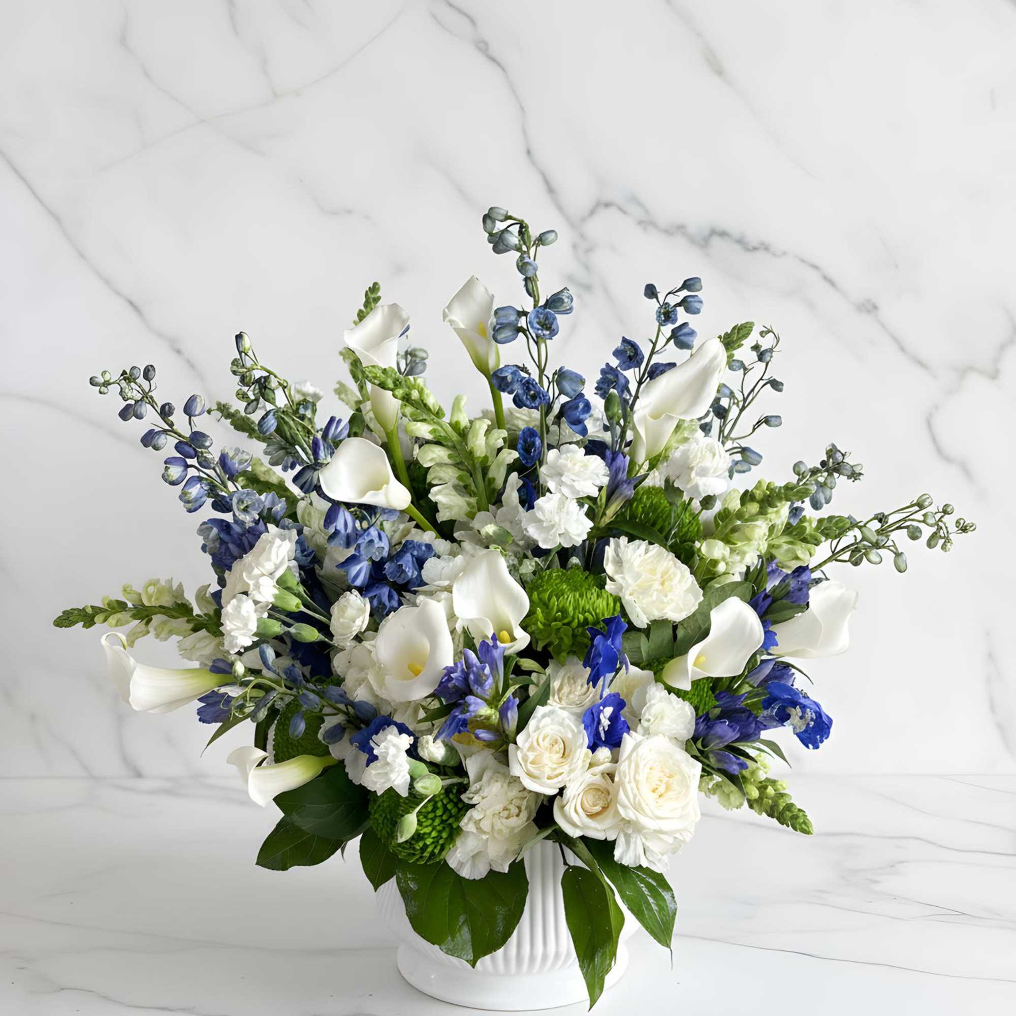 A refined and timeless floral arrangement featuring a stunning blend of crisp