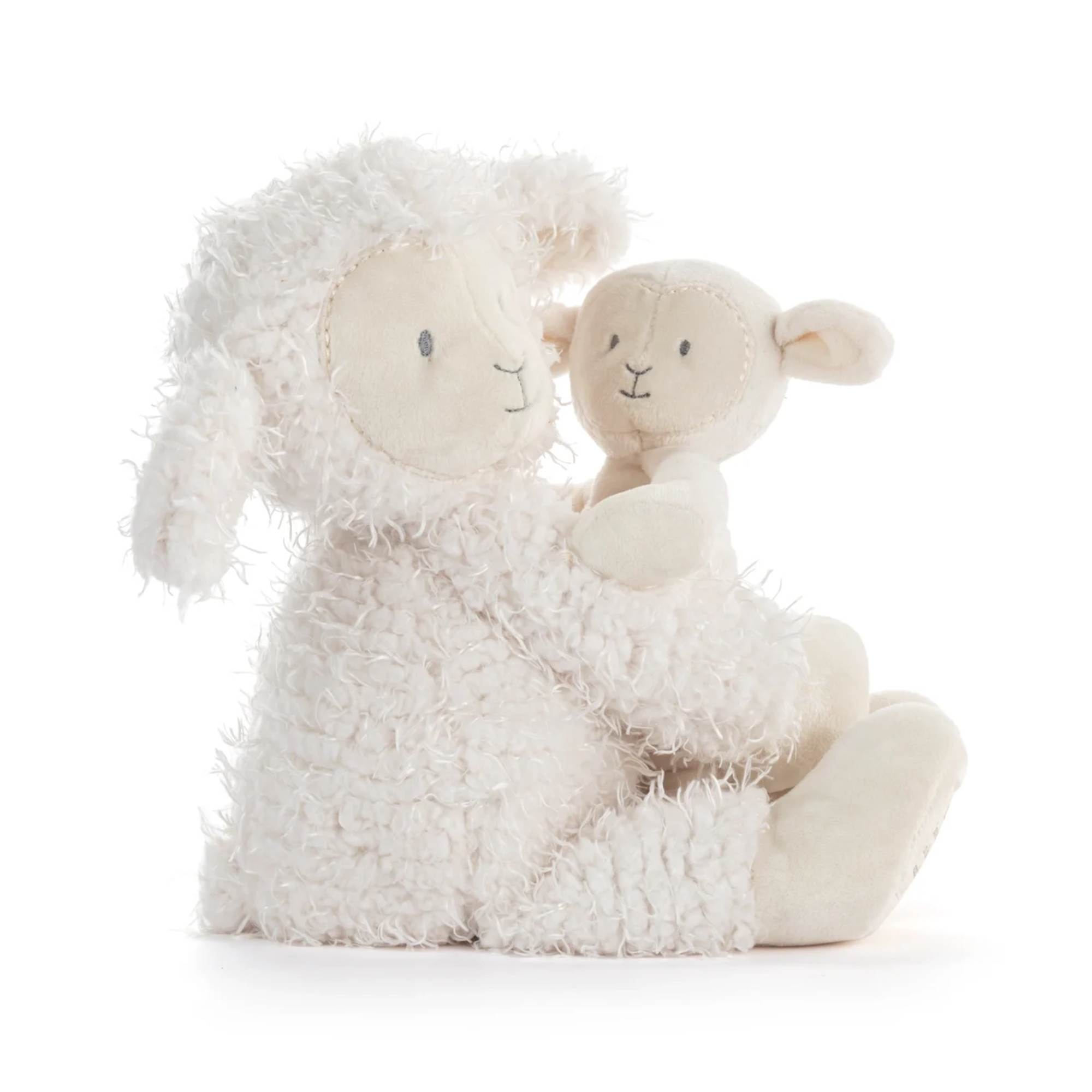 Two cream-colored plush lambs sitting together