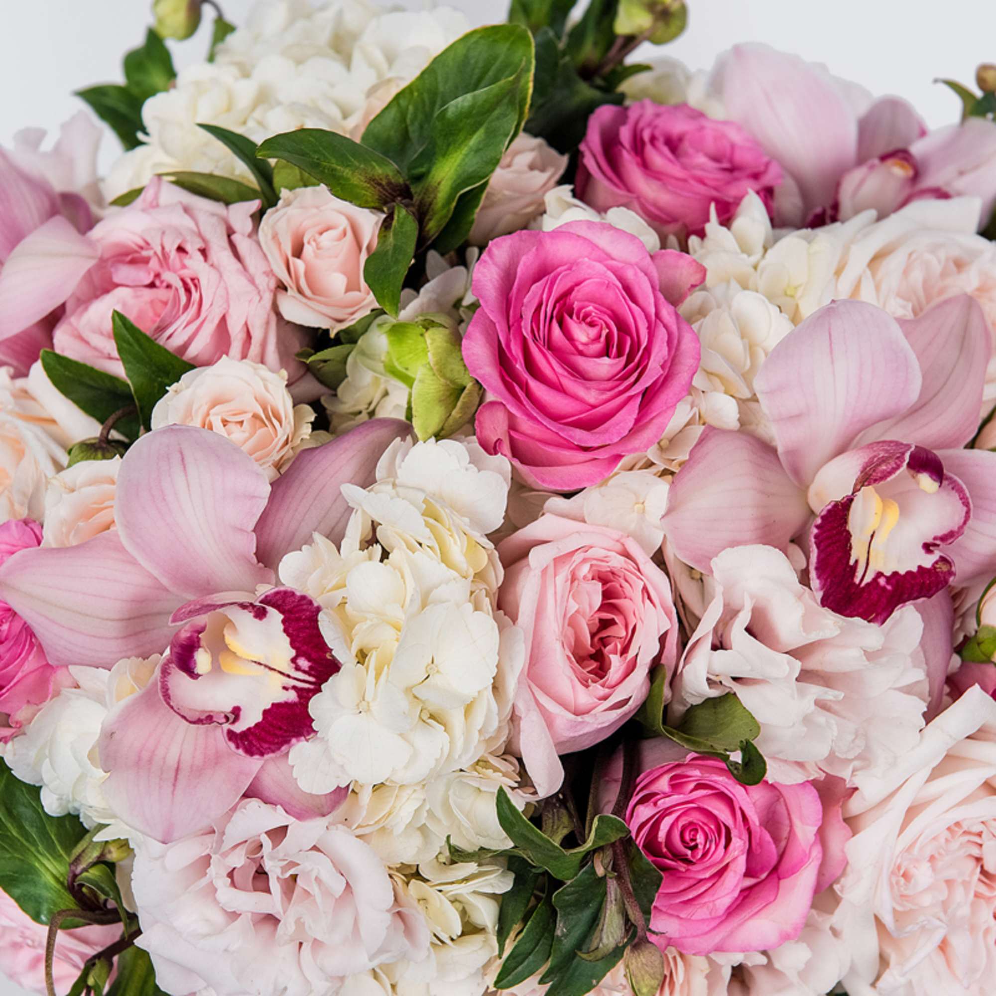 Pink and white bouquet with roses and orchids