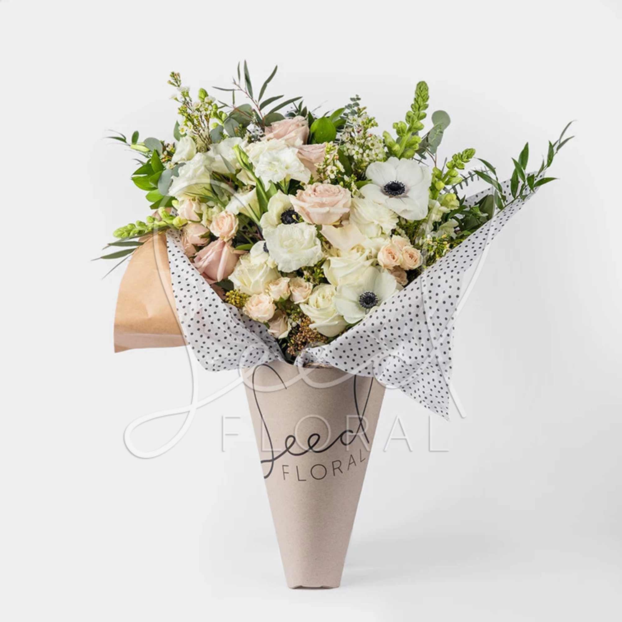 Designed in-house with a serene palette of seasonal neutral flowers. This exquisite