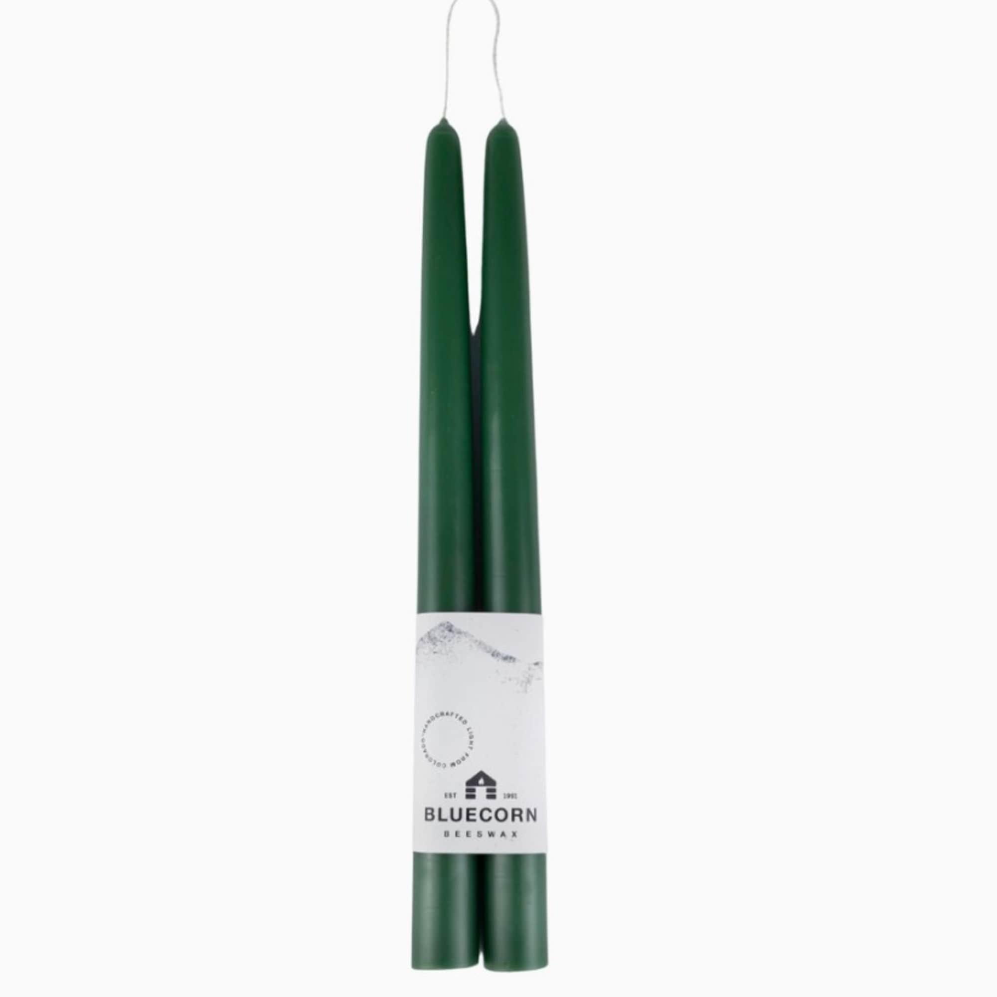Pair of dark green taper candles bundled with a branded paper label