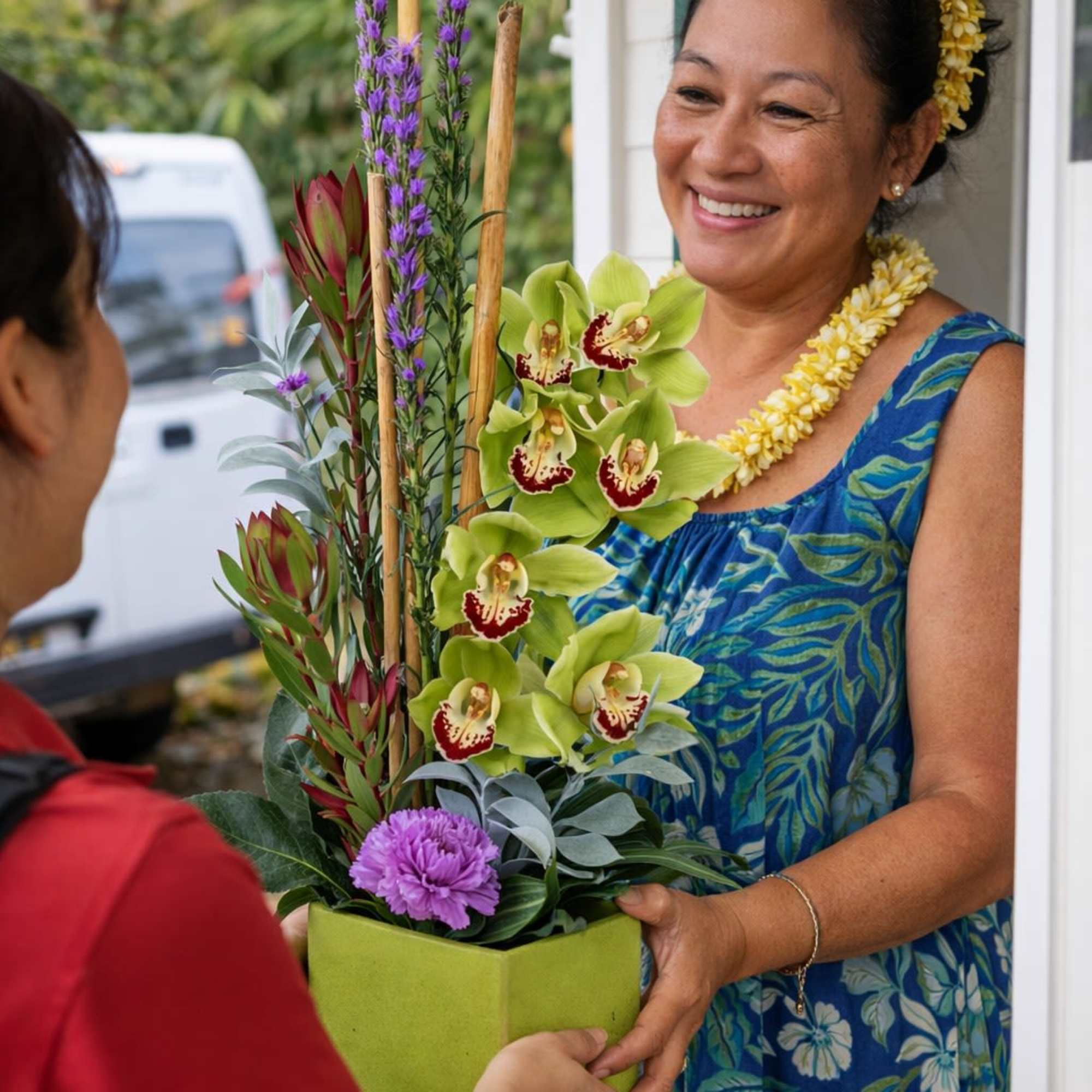 Featuring the stunning Cymbidium Orchid, this stylish arrangement is sure to bring