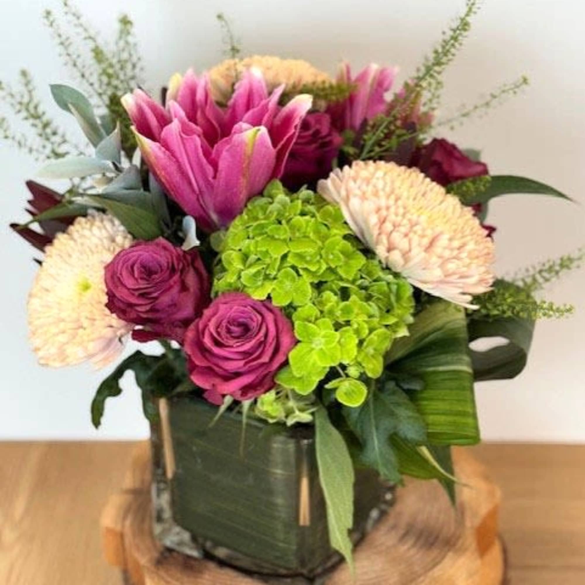 Celebrate Mom with a timeless and elegant gift. Our Motherly Love floral