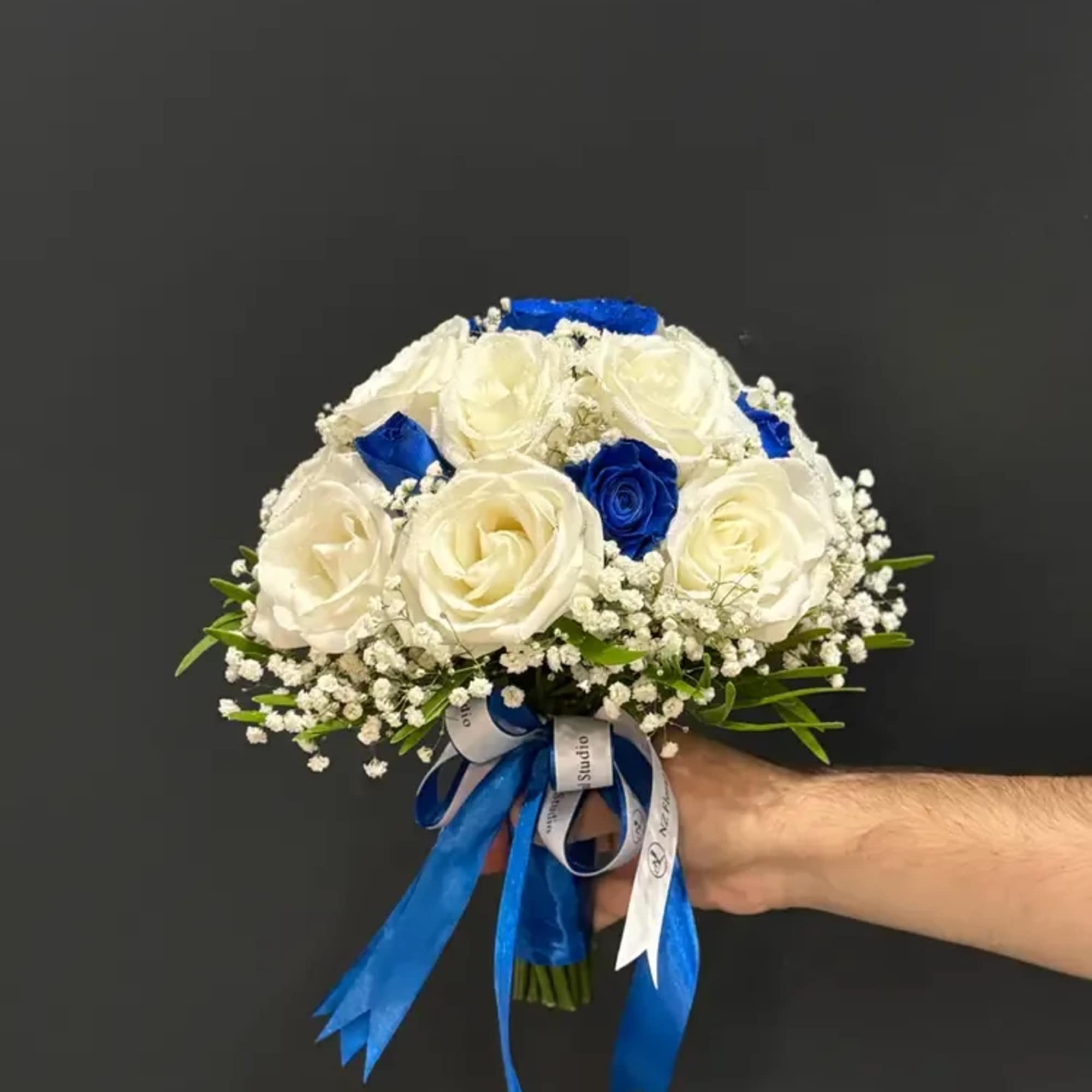 Blue Elegance Rose Bridal is a timeless wedding bouquet that pairs the