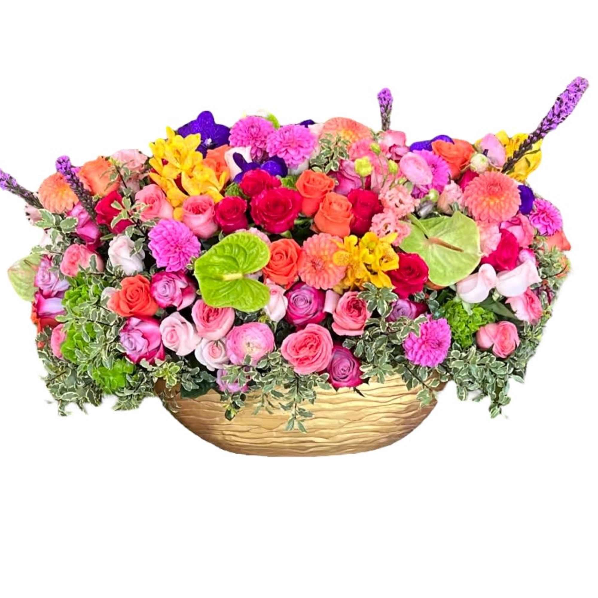 Colorful mixed flower arrangement in a low gold basket