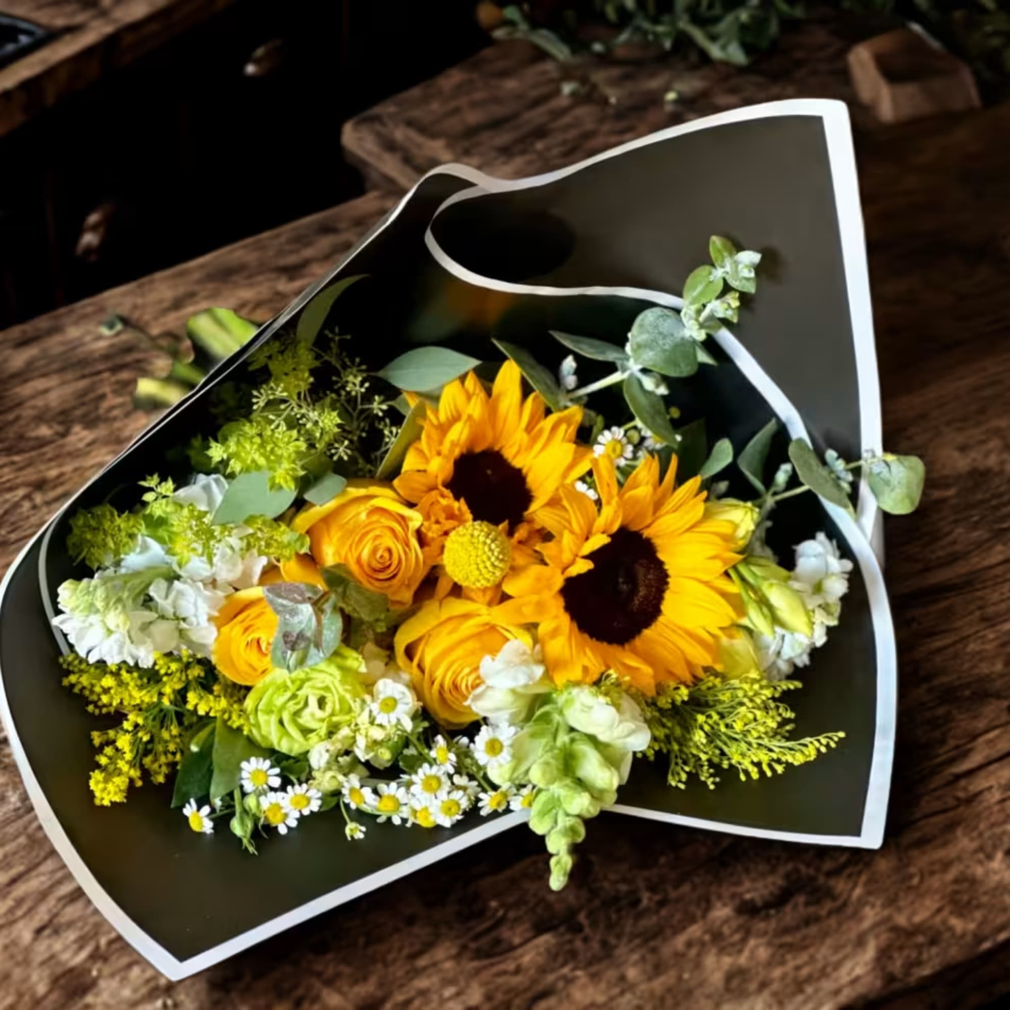 Sunshine Wrapped Bouquet by My Blooming Business is a radiant and cheerful