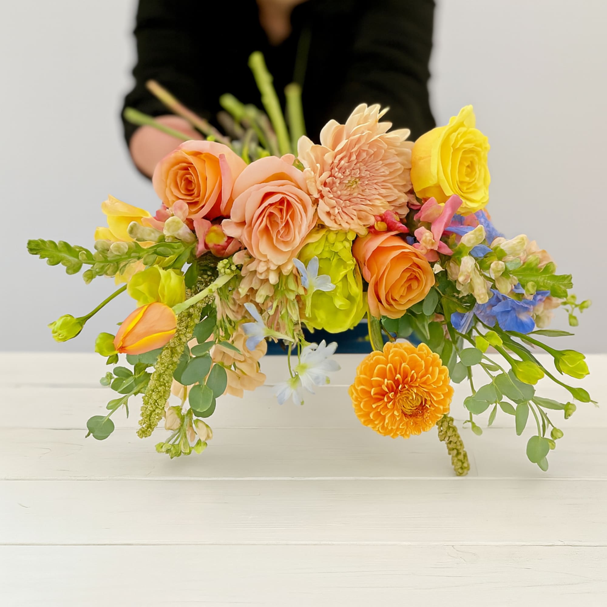 Colorful bouquet of roses, dahlias, and mixed blooms