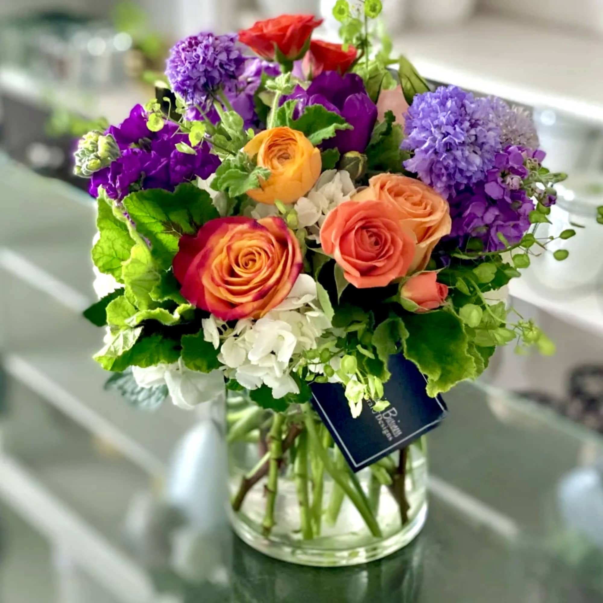 Colorful mixed bouquet in a clear glass vase