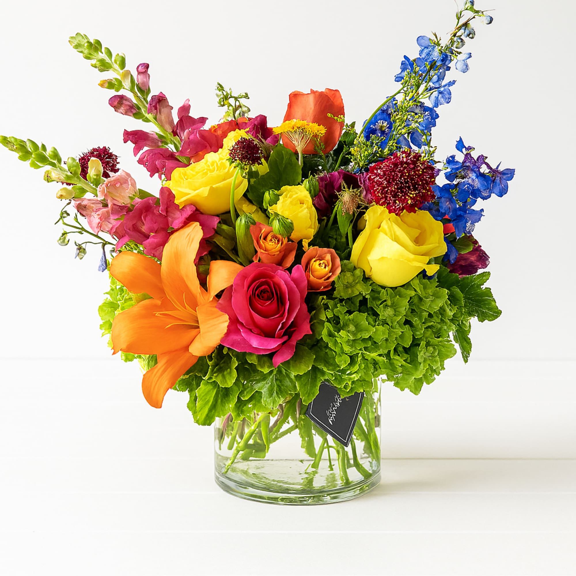 Colorful mixed bouquet in a clear glass vase