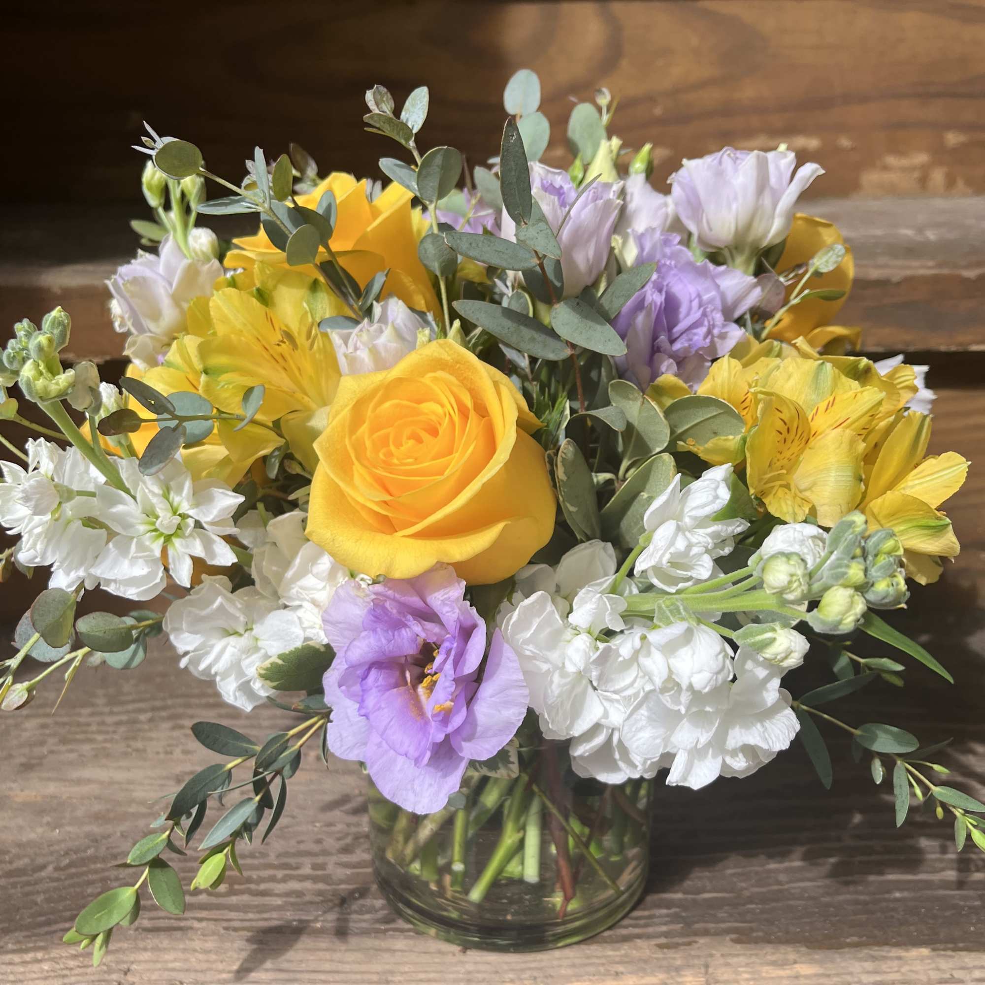 Yellow Roses, White Stock, Yellow Alstromeria and Lavender Lisianthus with a variety