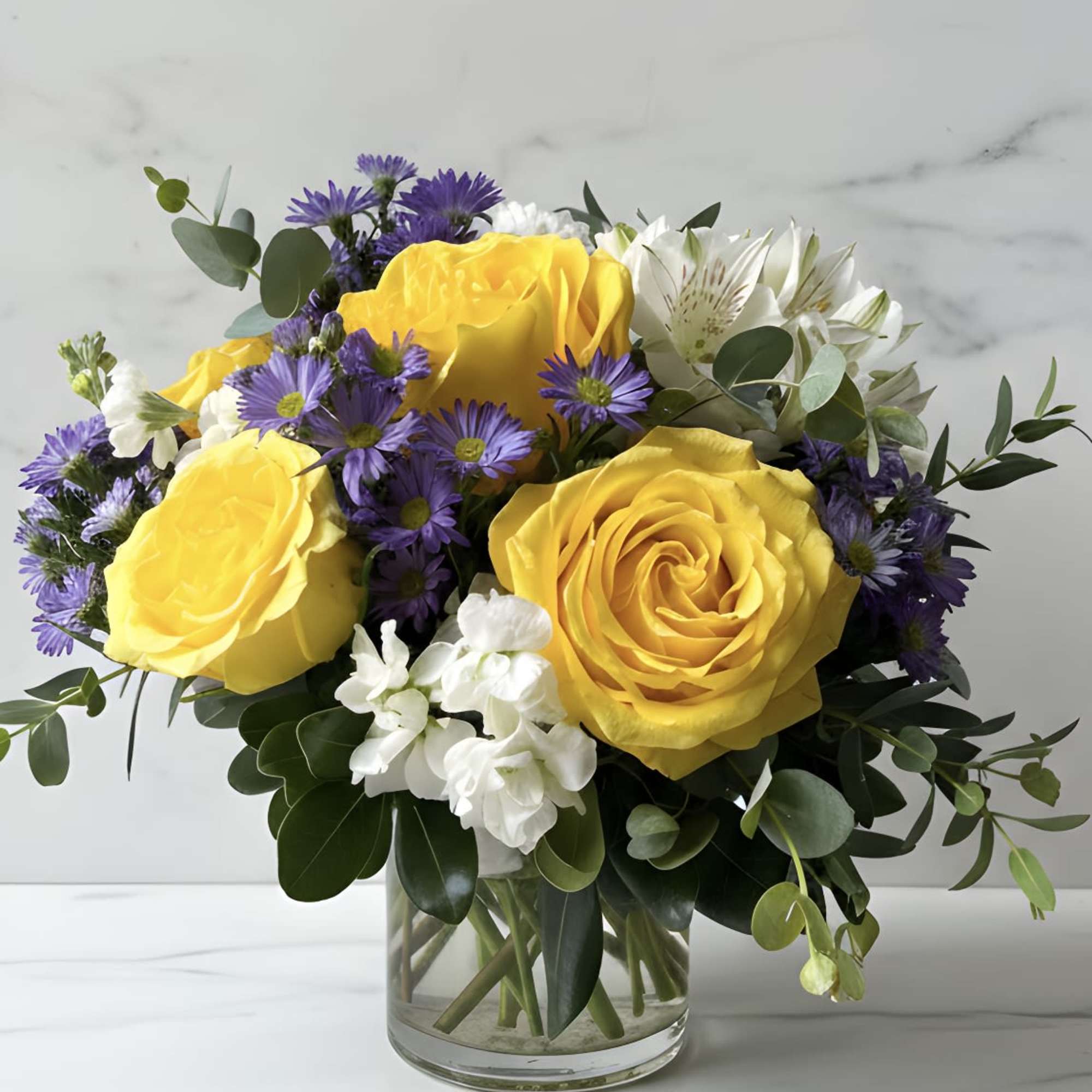 Yellow Roses, White Stock, Yellow Alstromeria and Lavender Lisianthus with a variety