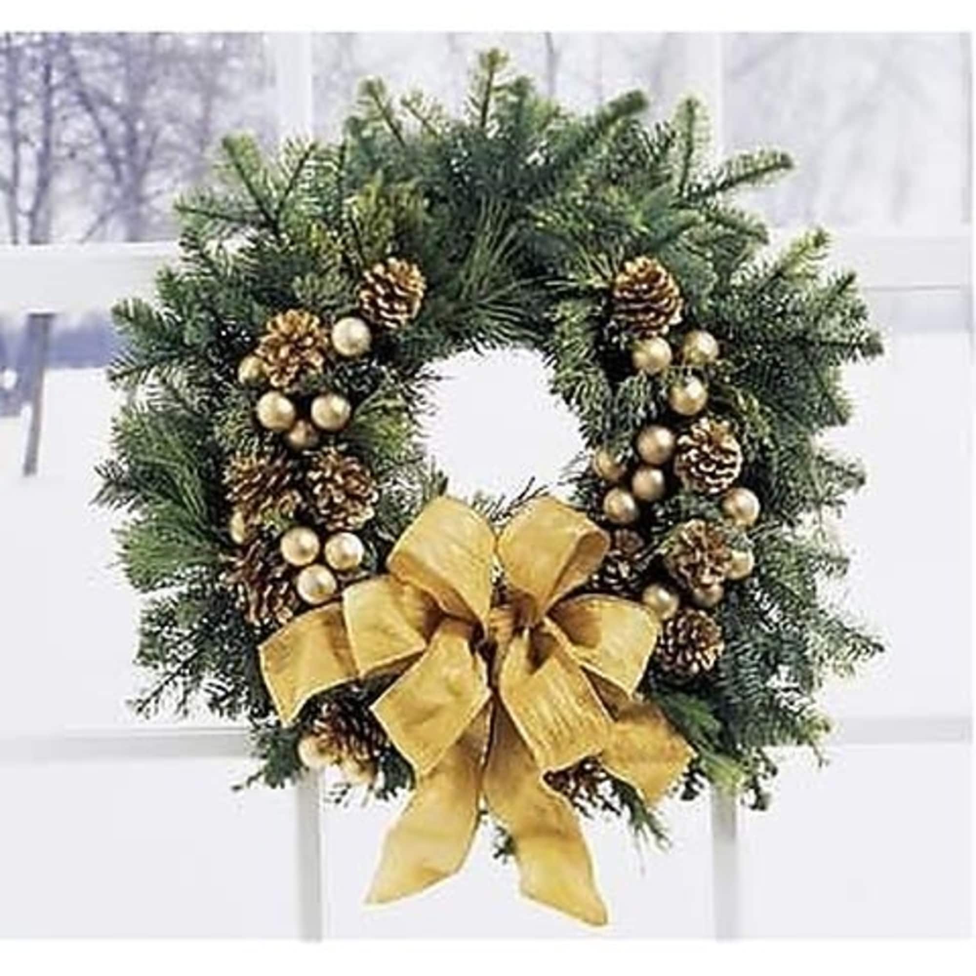 Decorate your door with this fresh wreath of mixed greens. Gold ornaments