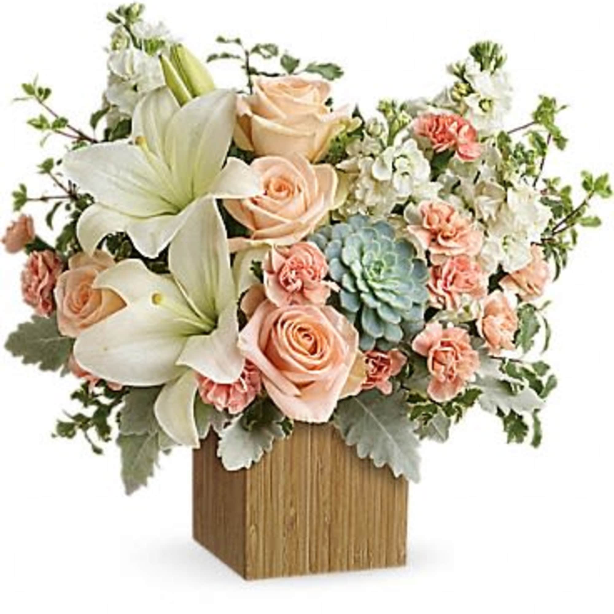 Peaceful yet energizing, this unforgettable arrangement of desert-hued blooms and succulents in