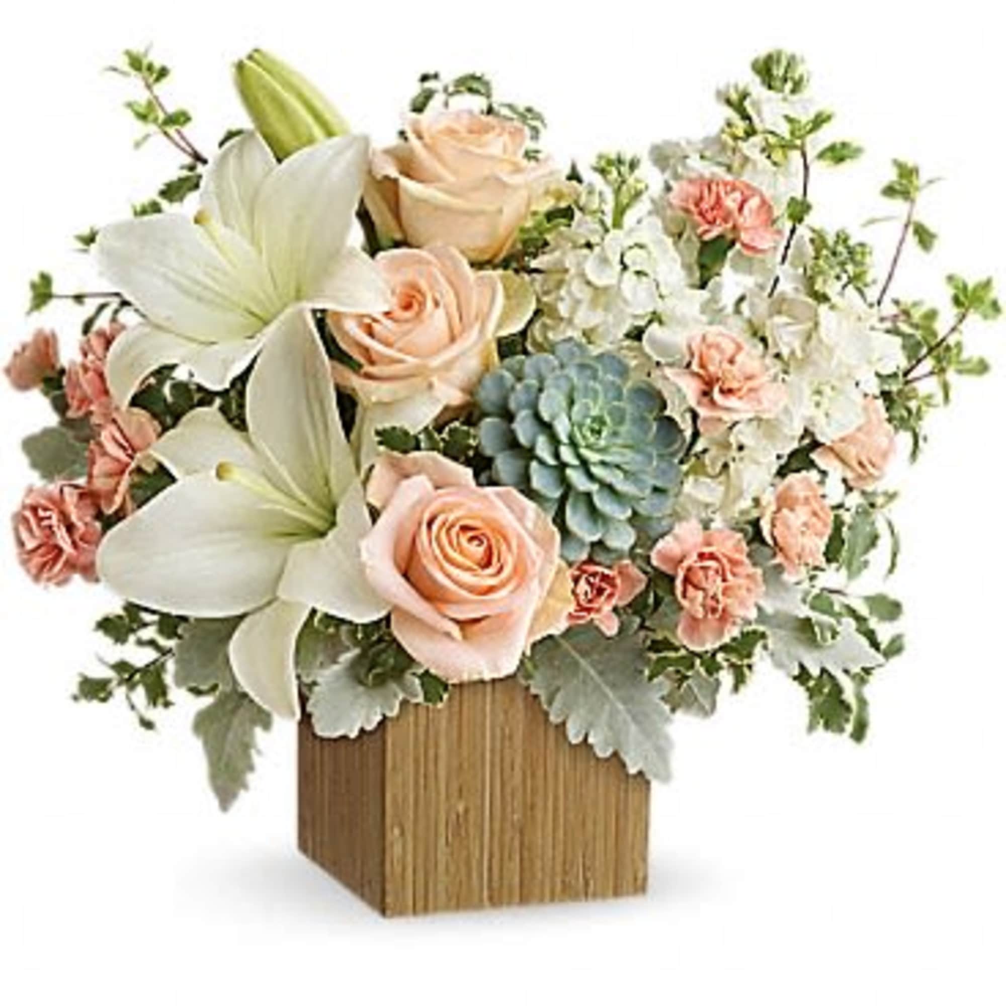 Peaceful yet energizing, this unforgettable arrangement of desert-hued blooms and succulents in