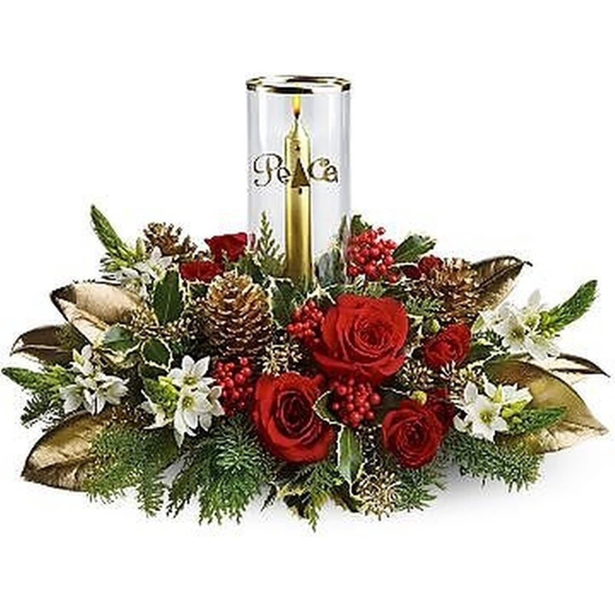 Holiday centerpiece with red roses, white flowers, pinecones and a gold candle in a glass holder