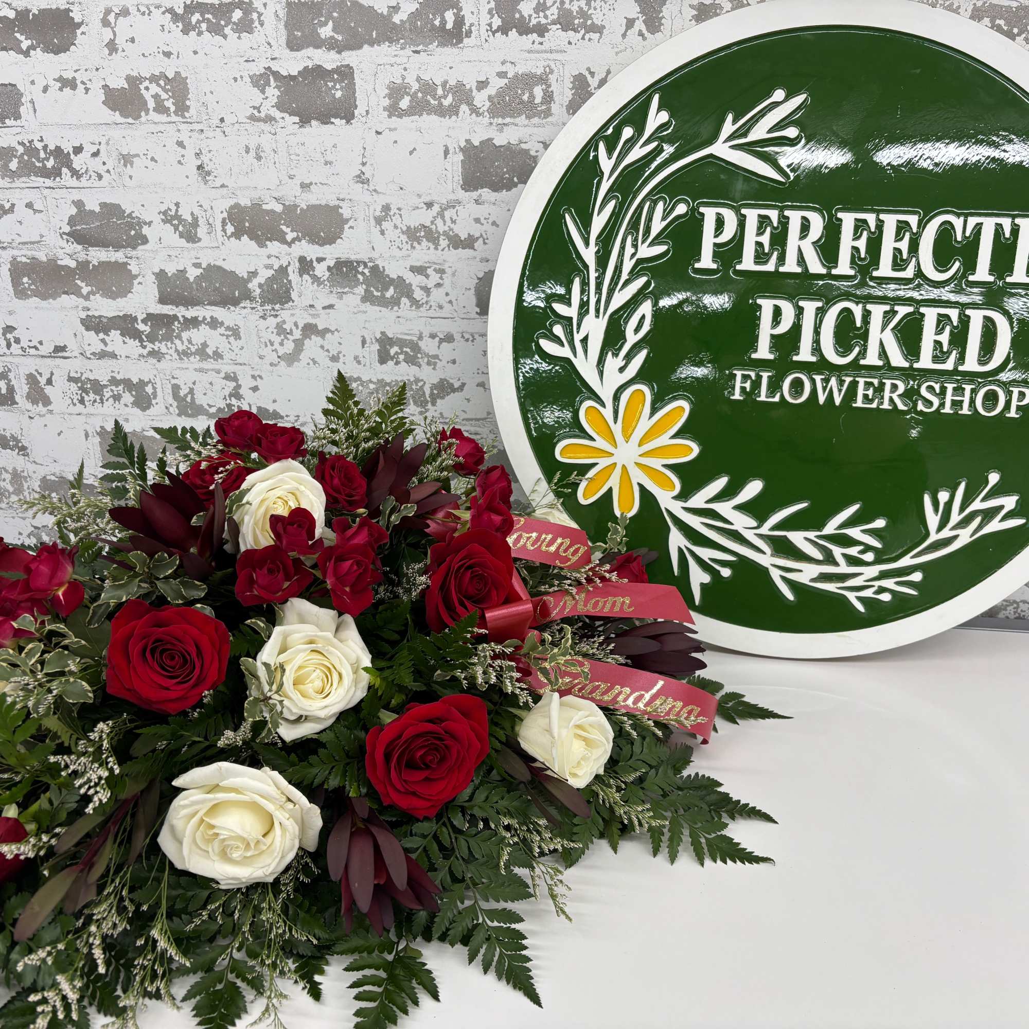 Nestled within a bed of lush greenery, each bloom reflects the spirit
