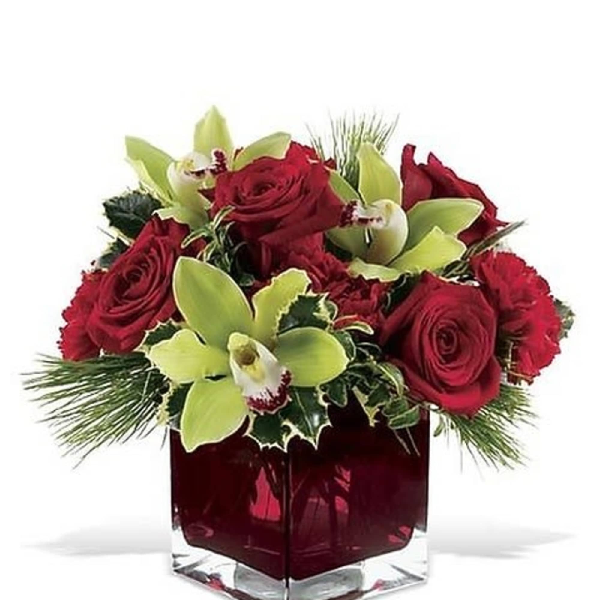 This glorious Christmas floral arrangement of red blossoms, evergreens and holly includes
