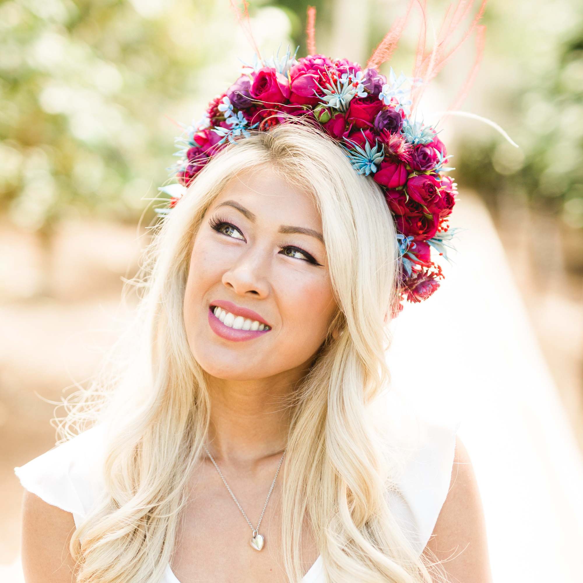 Woman wearing a pink and blue floral crown