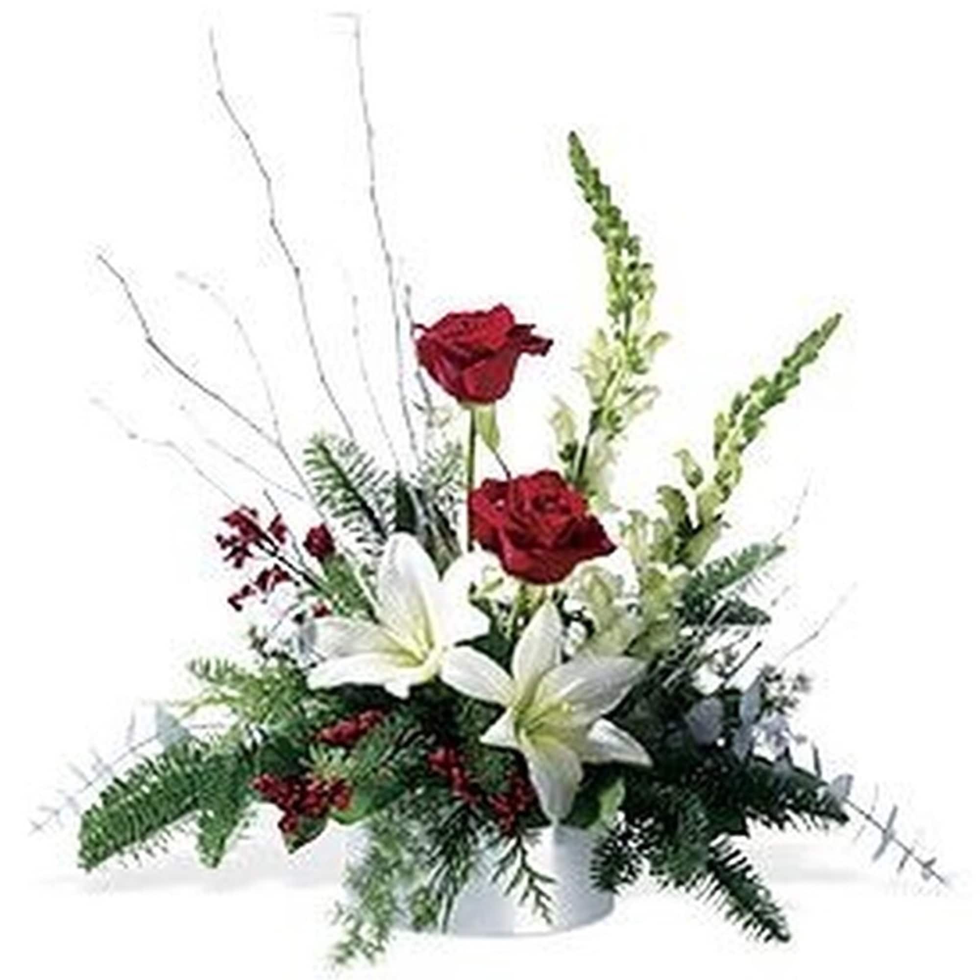Low centerpiece with red roses and white lilies in a white container with decorative white branches