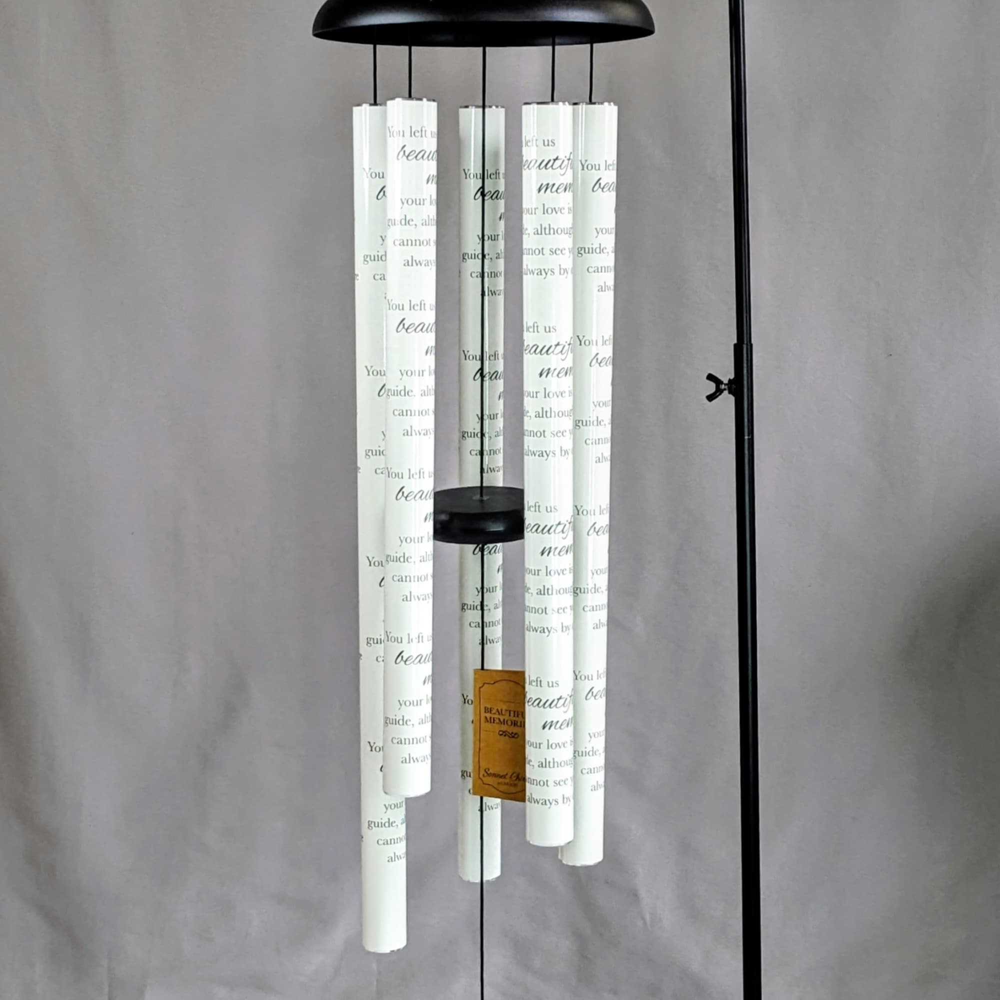 Hanging memorial wind chime with white tubes and black frame