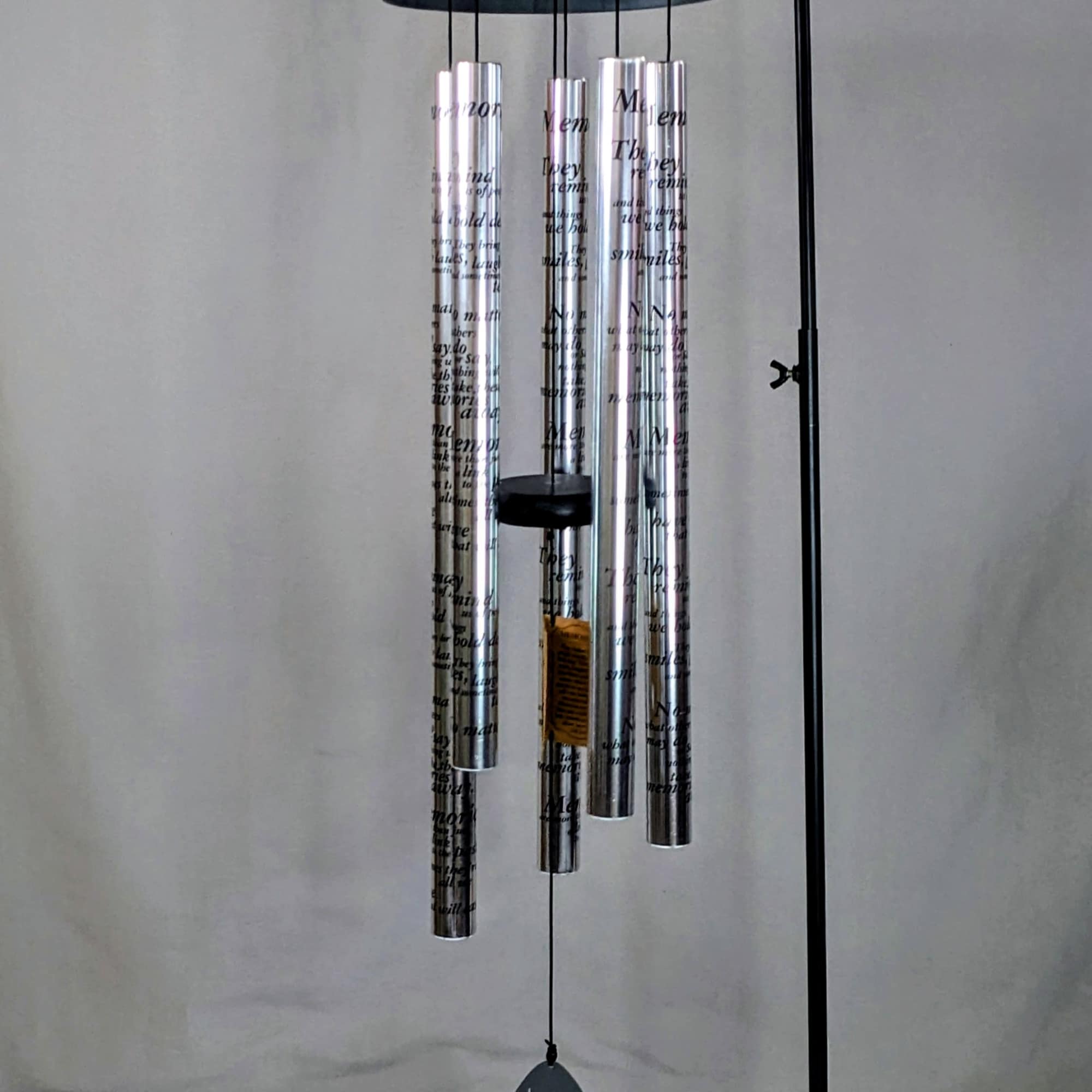 Metal wind chime with silver tubes and a hanging clapper