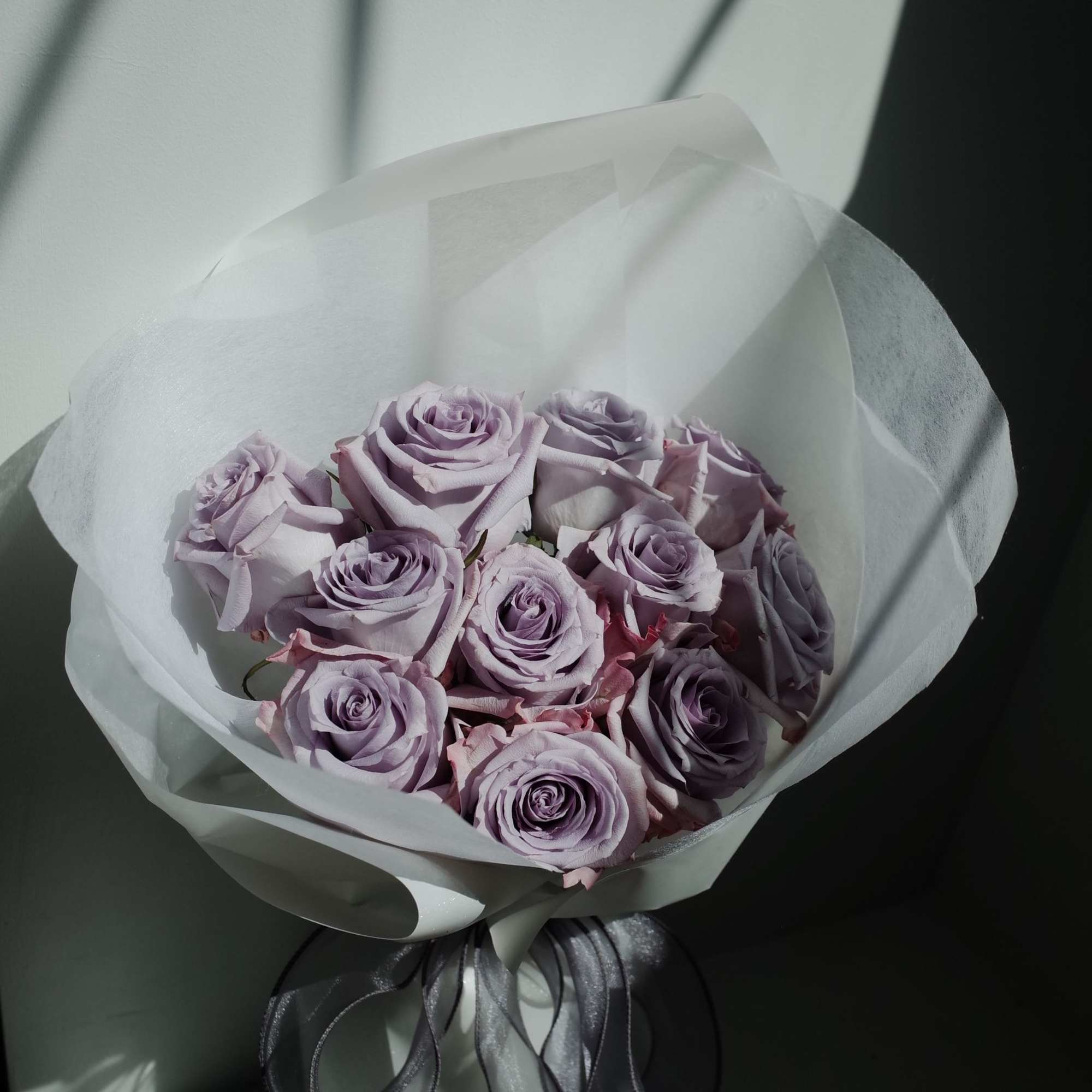 A dreamy arrangement of premium lavender roses, each bloom opening in soft