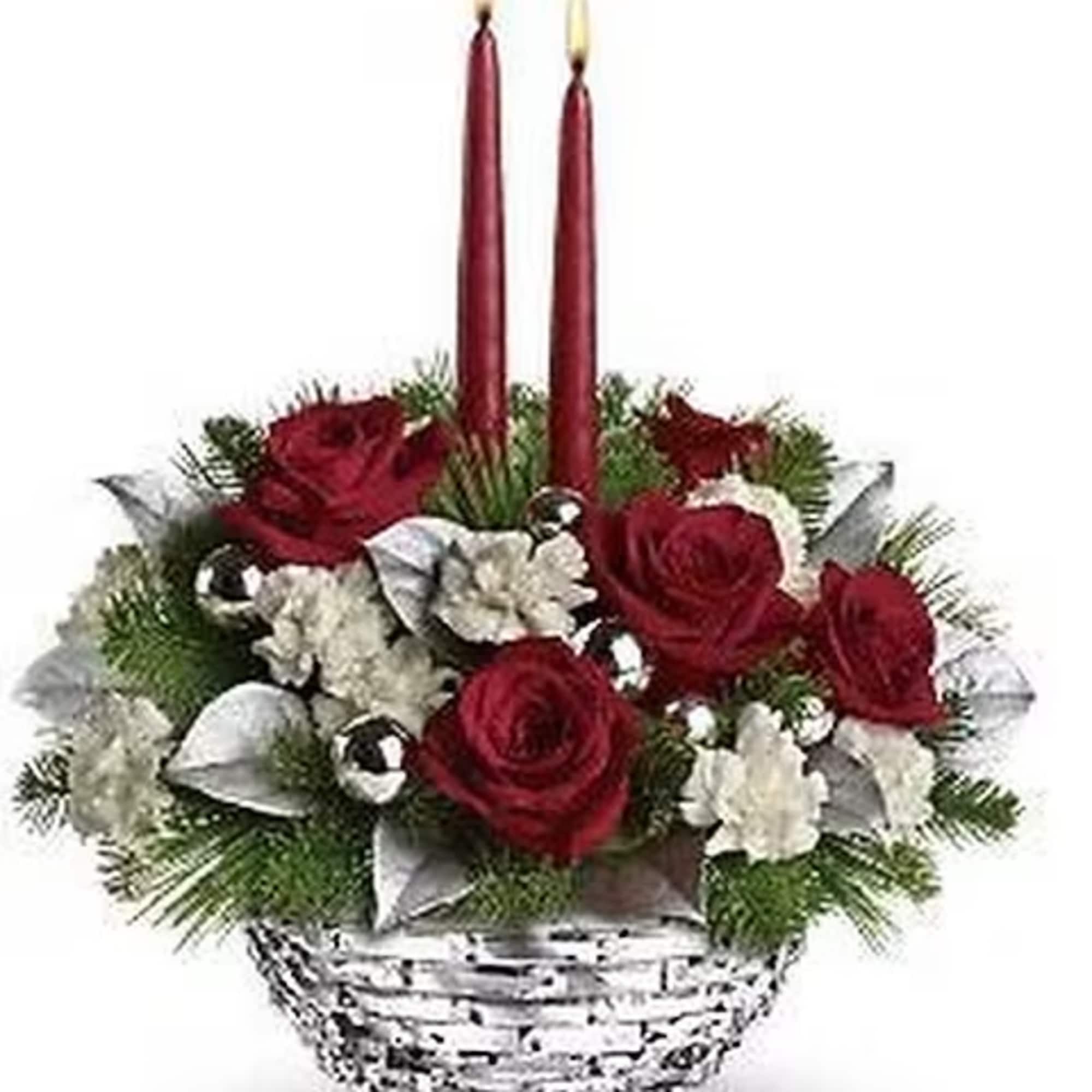 Santa's little sparkler! Red roses and white miniature carnations are arranged in