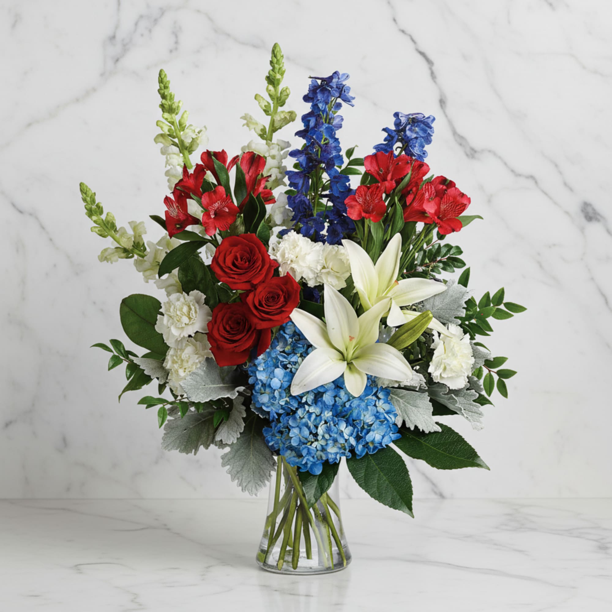 Perfectly patriotic with its red, white and blue blooms, this bold bouquet
