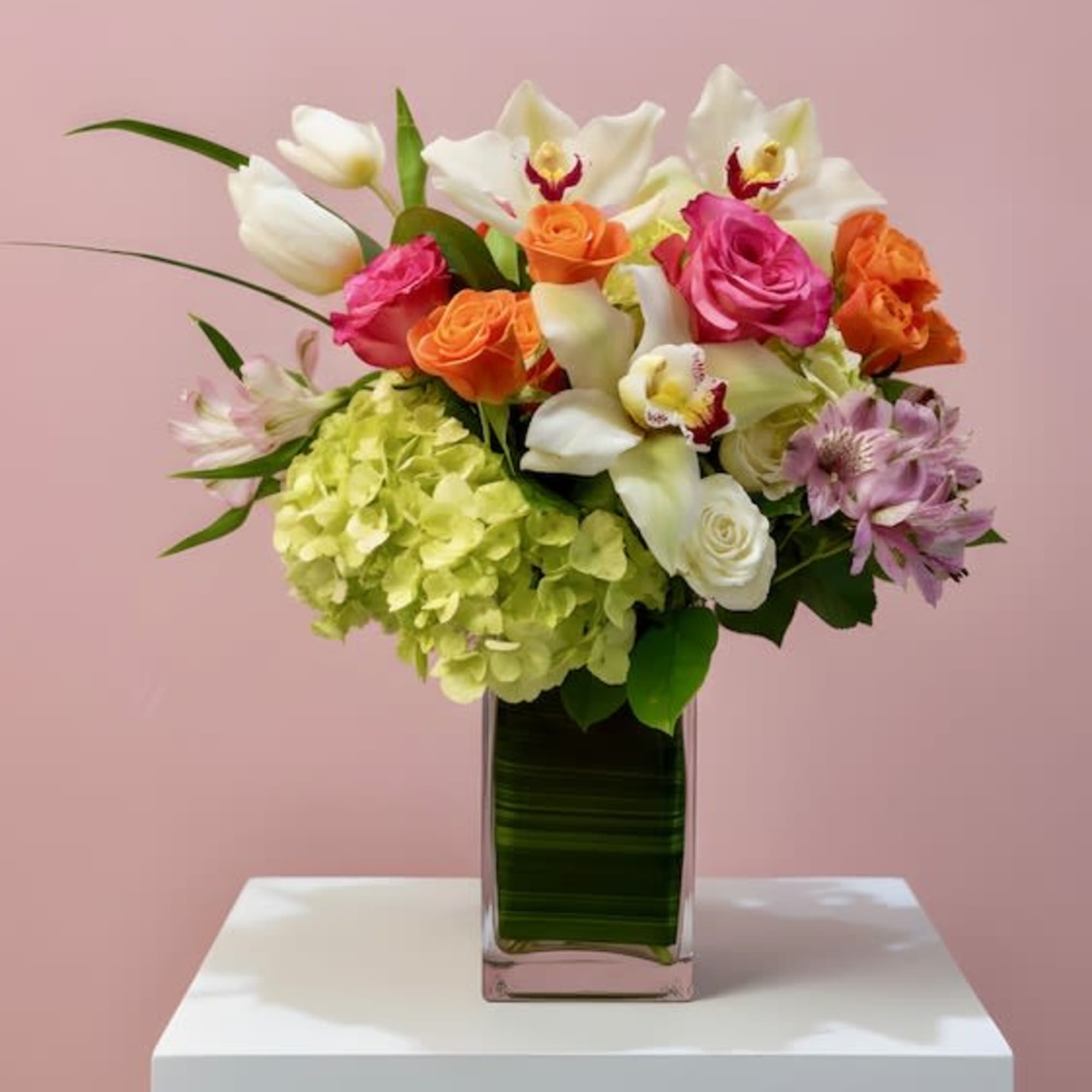 A luxurious blend of orchids, roses, hydrangeas, and seasonal blooms, thoughtfully designed
